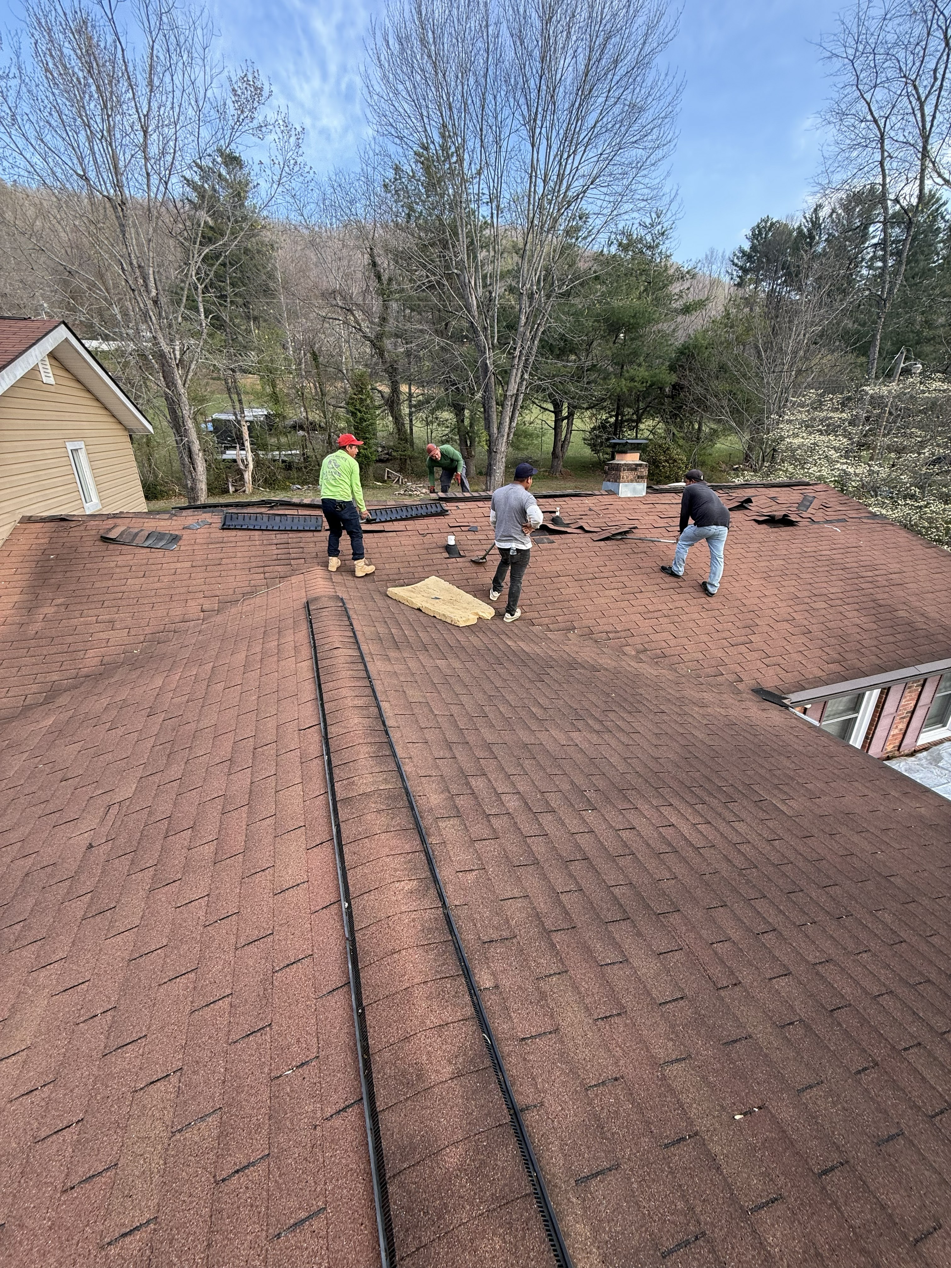 AroLite Group roofing team at work on a residential roof in Western NC