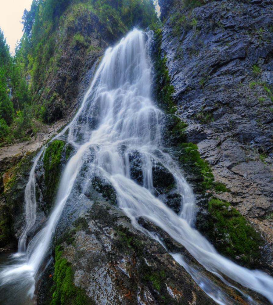 Castles Peaks Cascades daytrips cluj napoca — Cascada Răchițele tumbling through ancient spruce forest