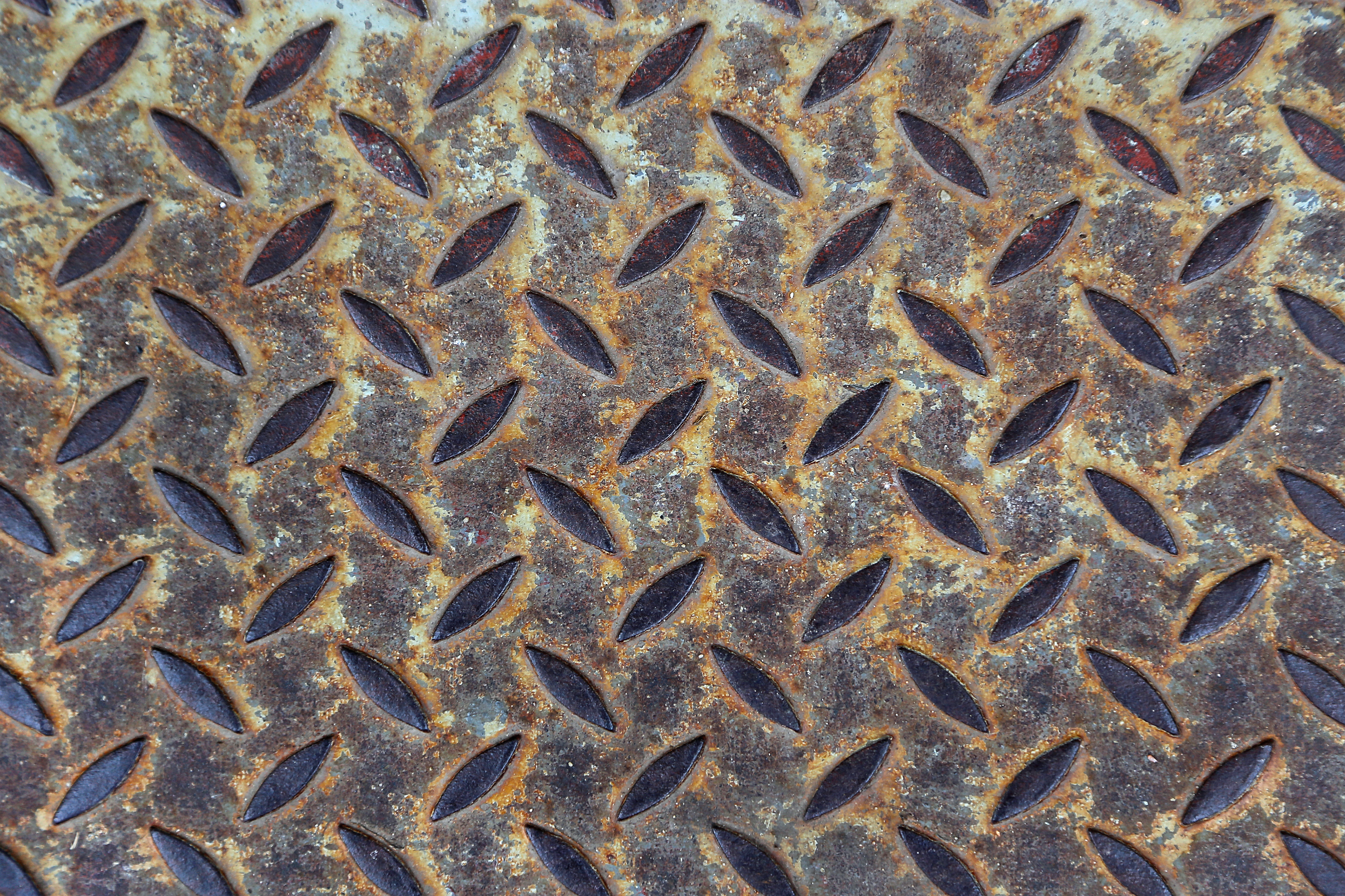 Rusty metal diamond plate before sandblasting restoration