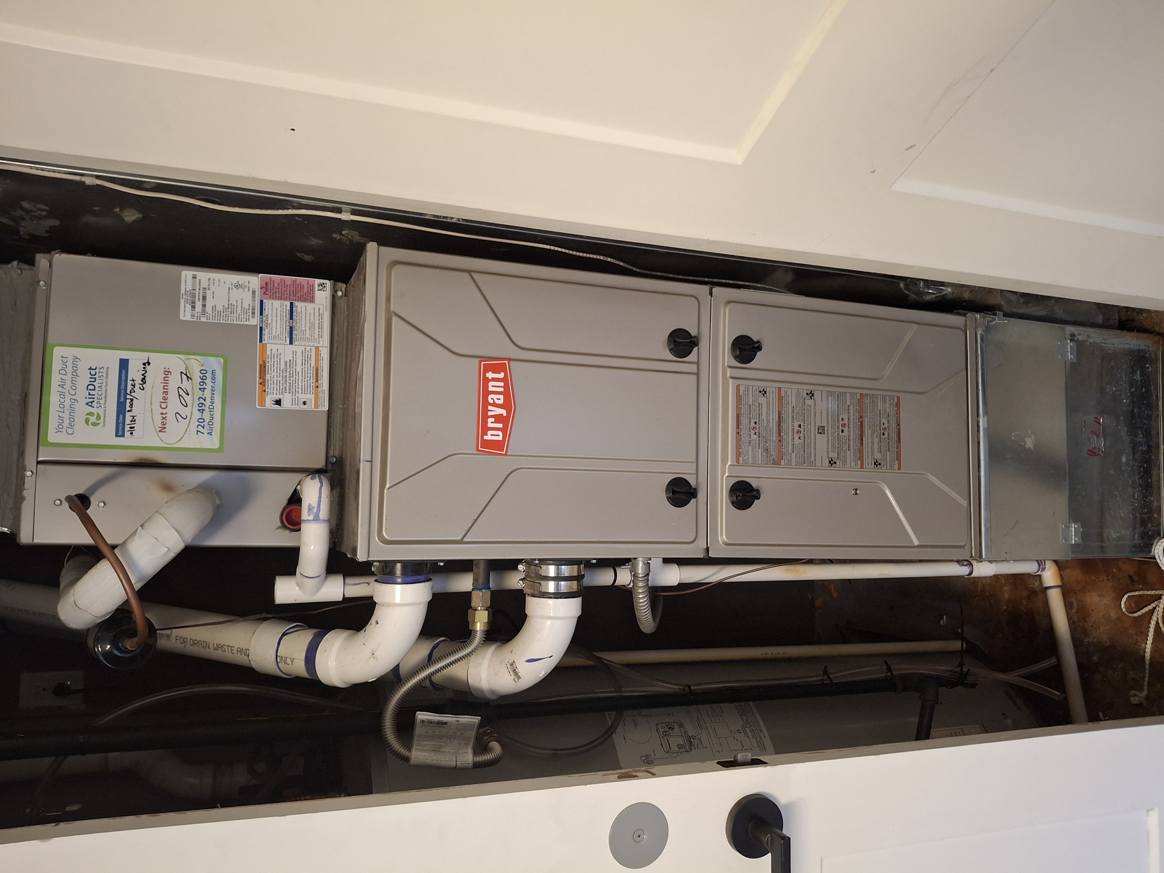 Professional Bryant furnace installation in residential utility room — real HVAC work by Da'Waterboyz