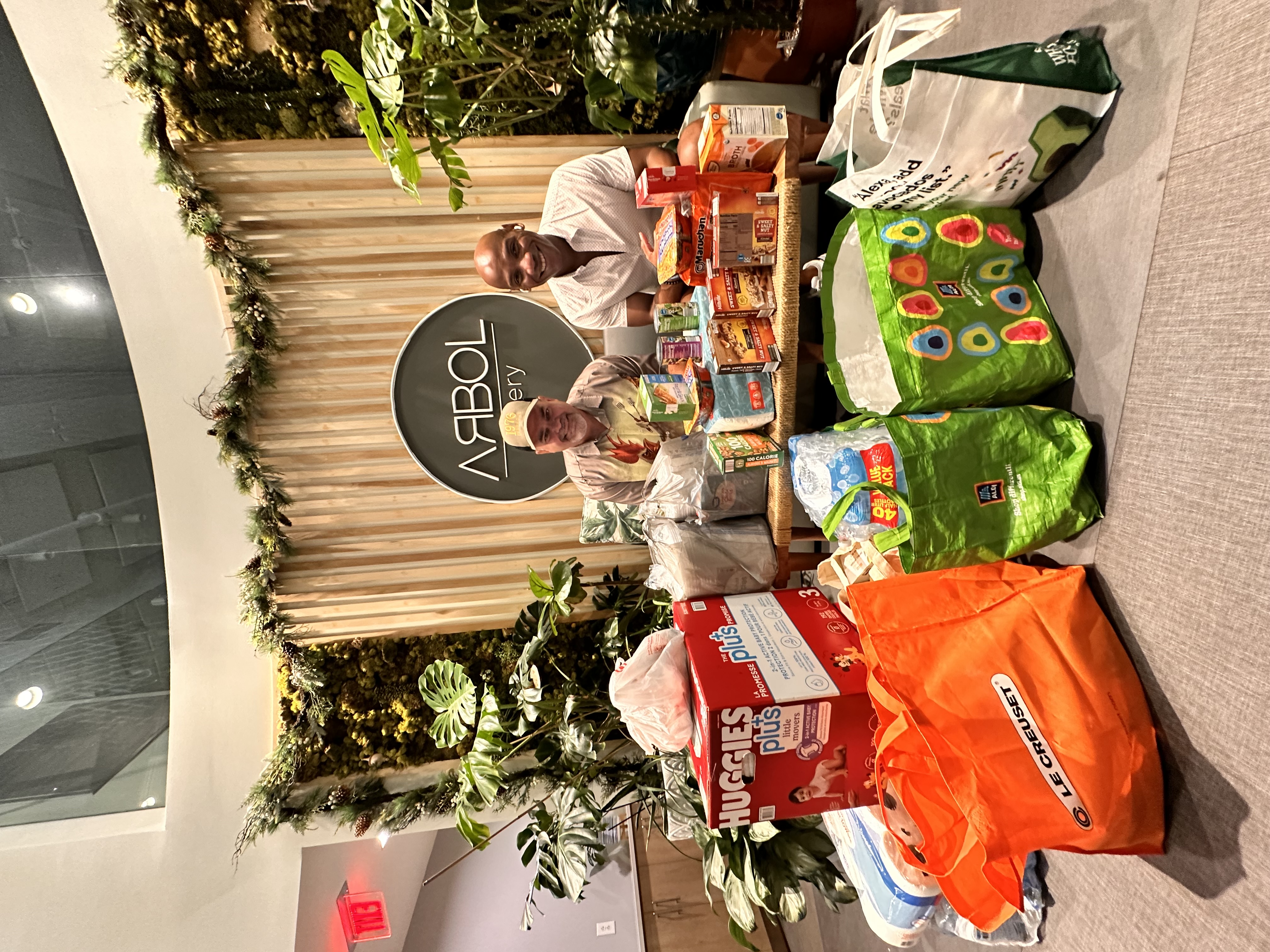 Mitchell Coles and Gus the Butcher at Arbol Eatery during the Western NC hurricane relief donation drive