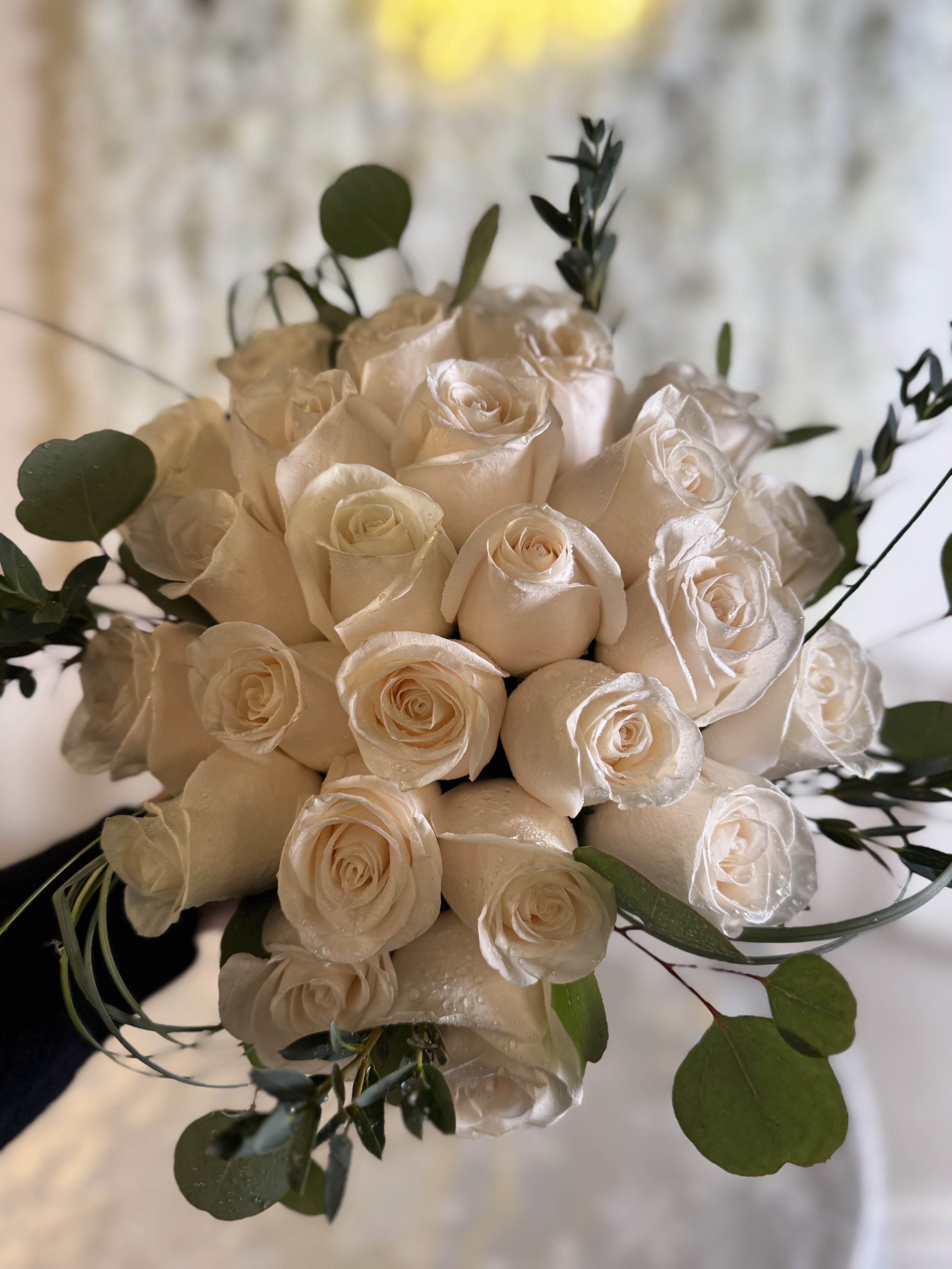 Romantic white rose and peony bridal bouquet with cascading greenery