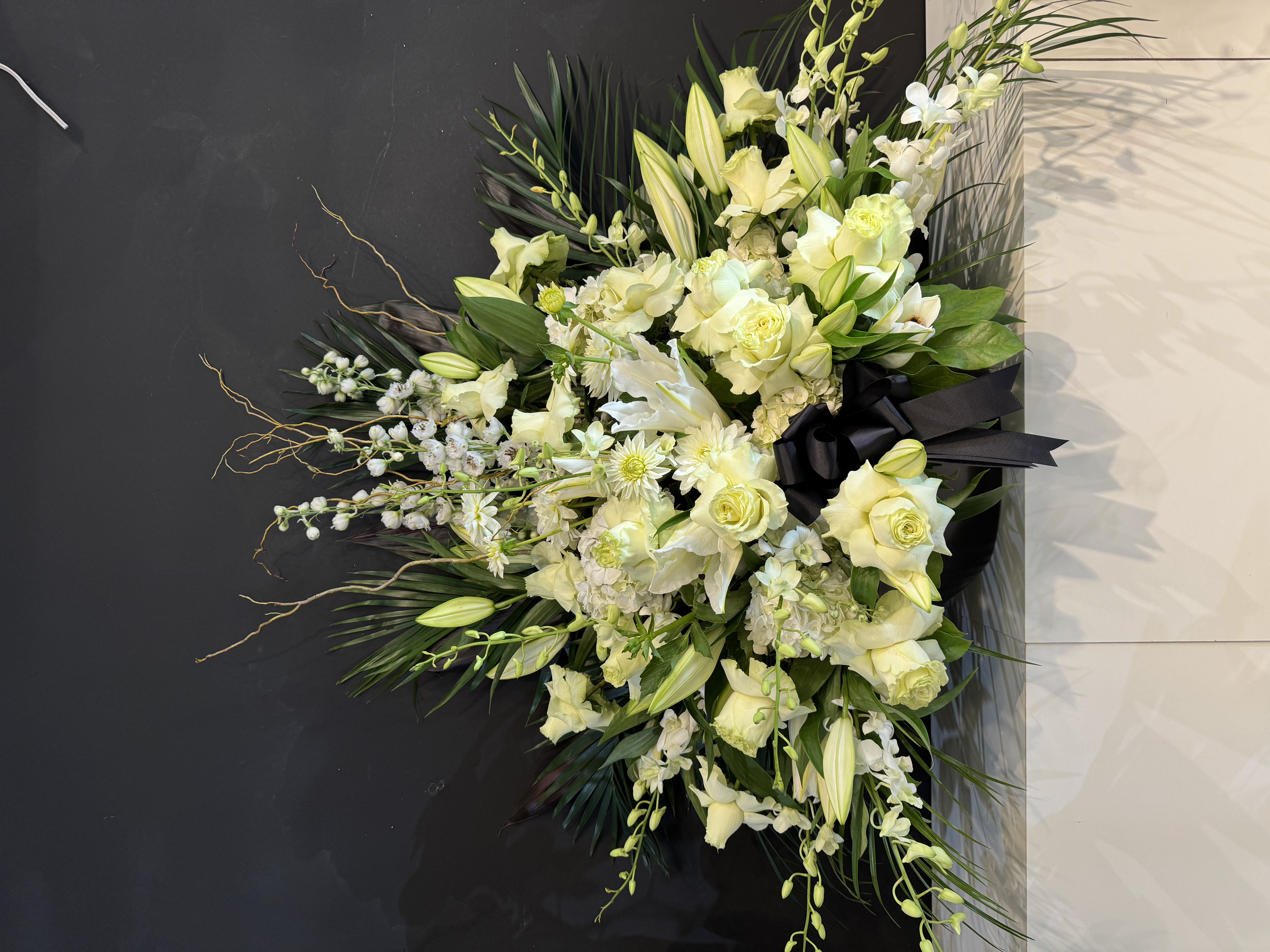 Elegant white calla lily and snapdragon floor standing spray