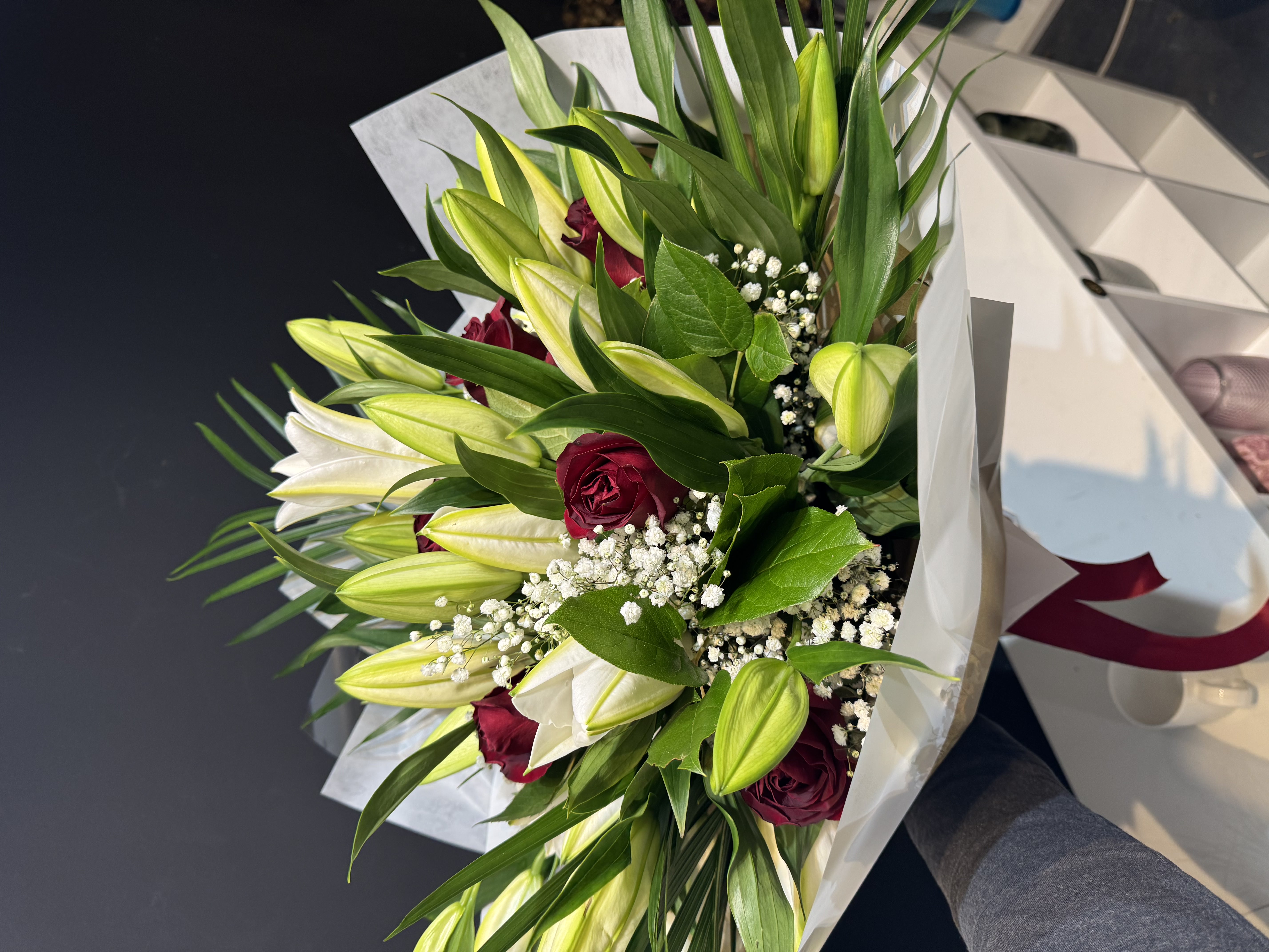 Vibrant mixed flower bouquet with pink roses and lilies