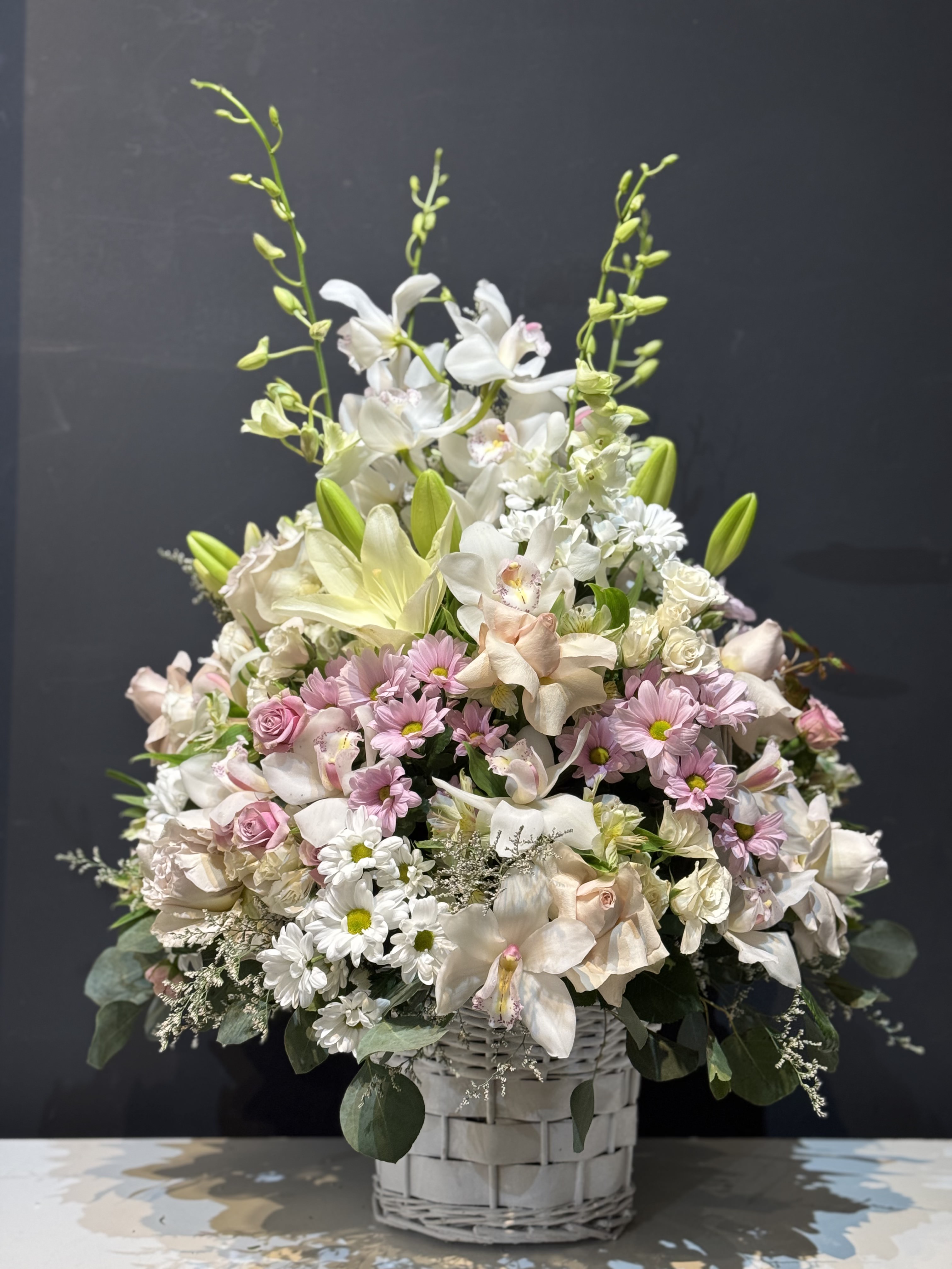 Lush pink and cream rose cascade bouquet with trailing ivy