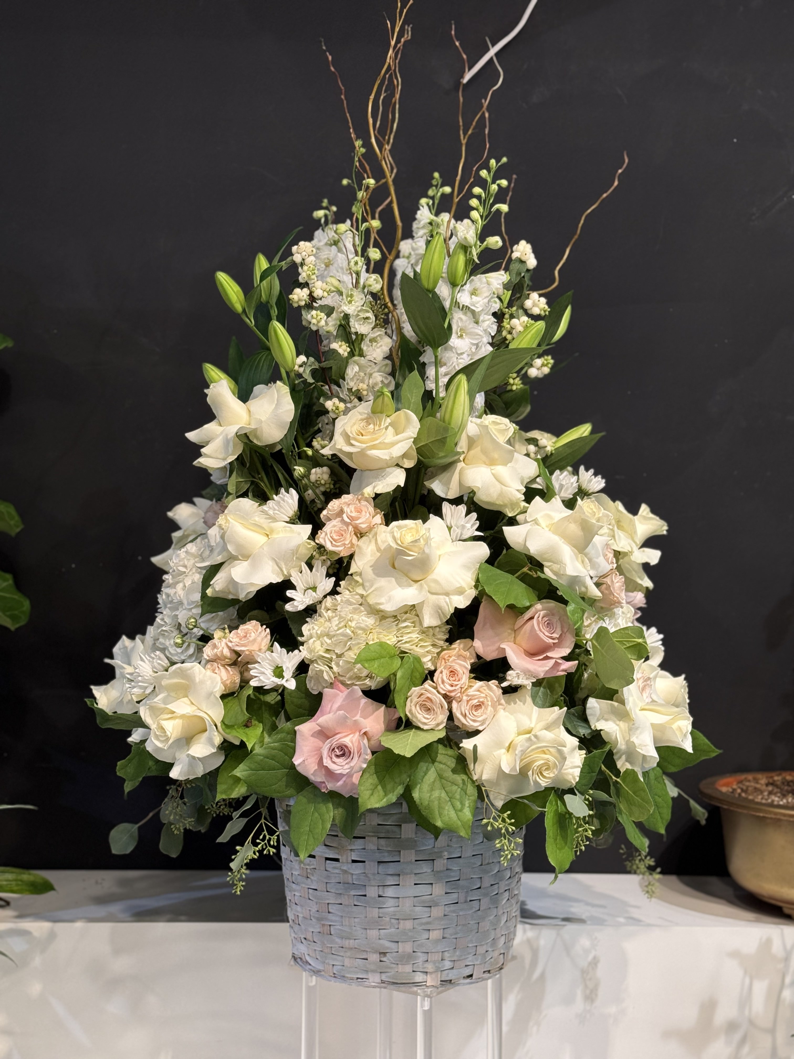 Lush garden-style bridal bouquet with mixed white blooms and greenery