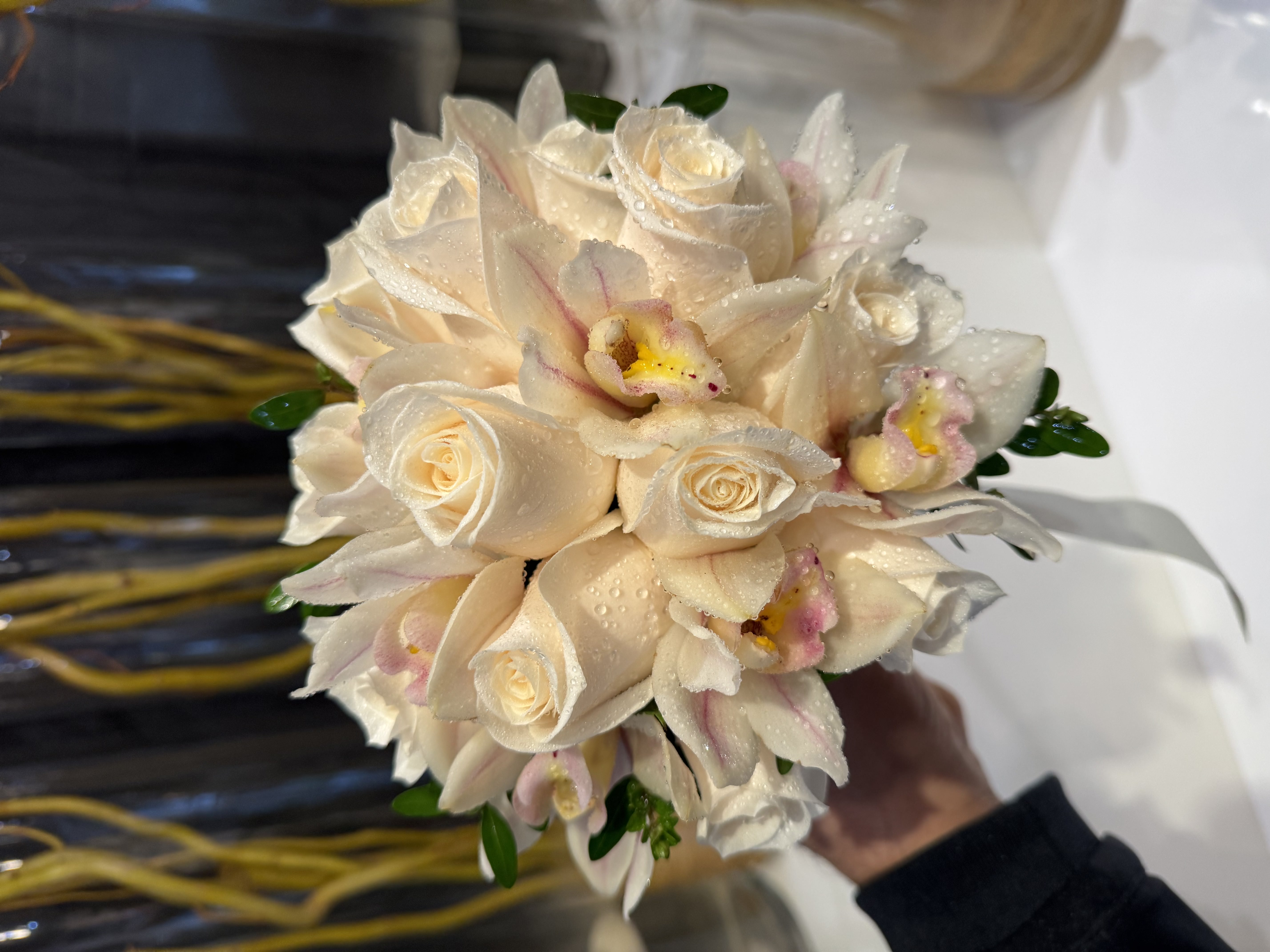 Fresh dewdrop-adorned white rose bridal bouquet with morning freshness