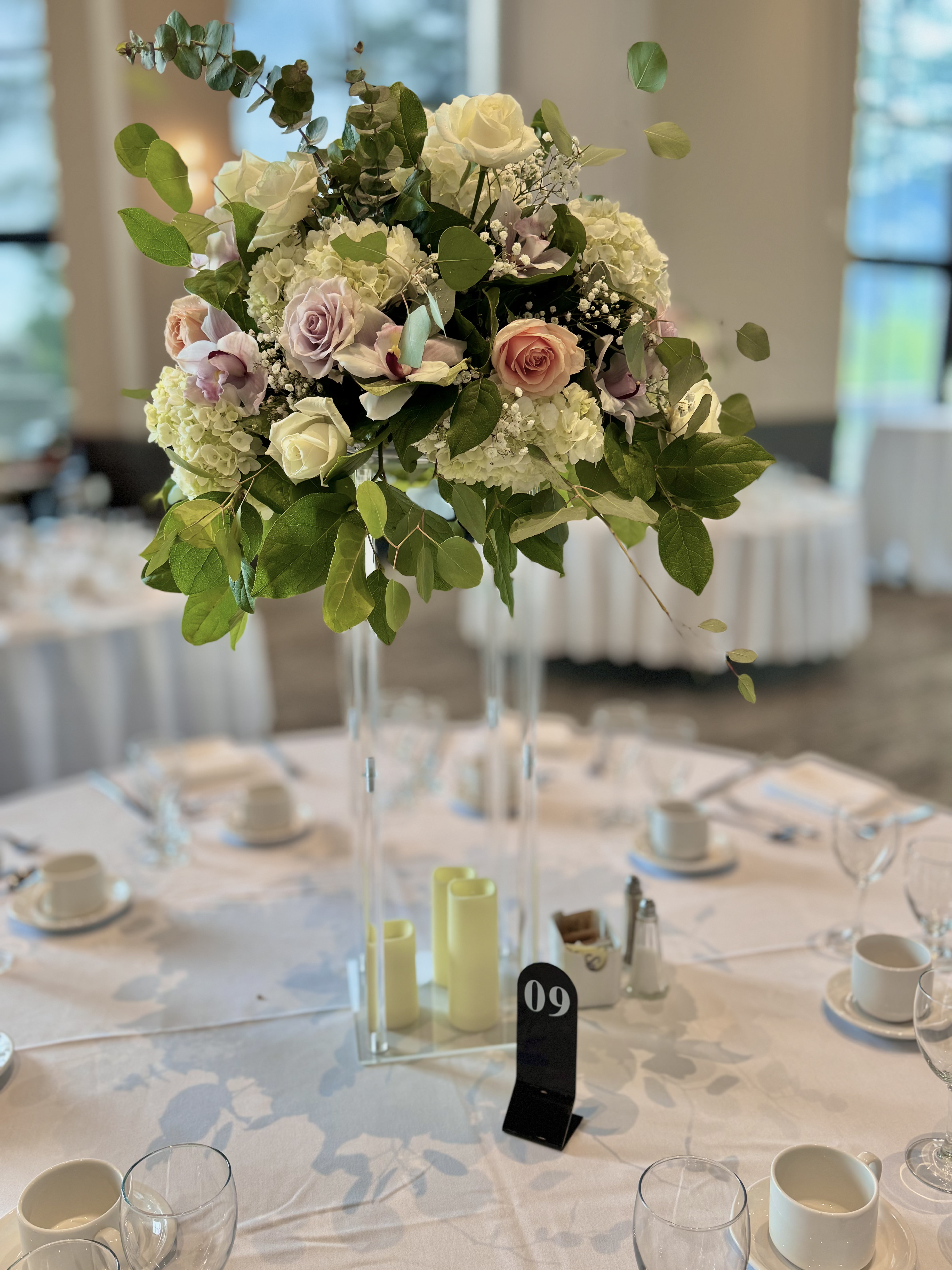 White and blush garden rose arrangement with eucalyptus and baby breath