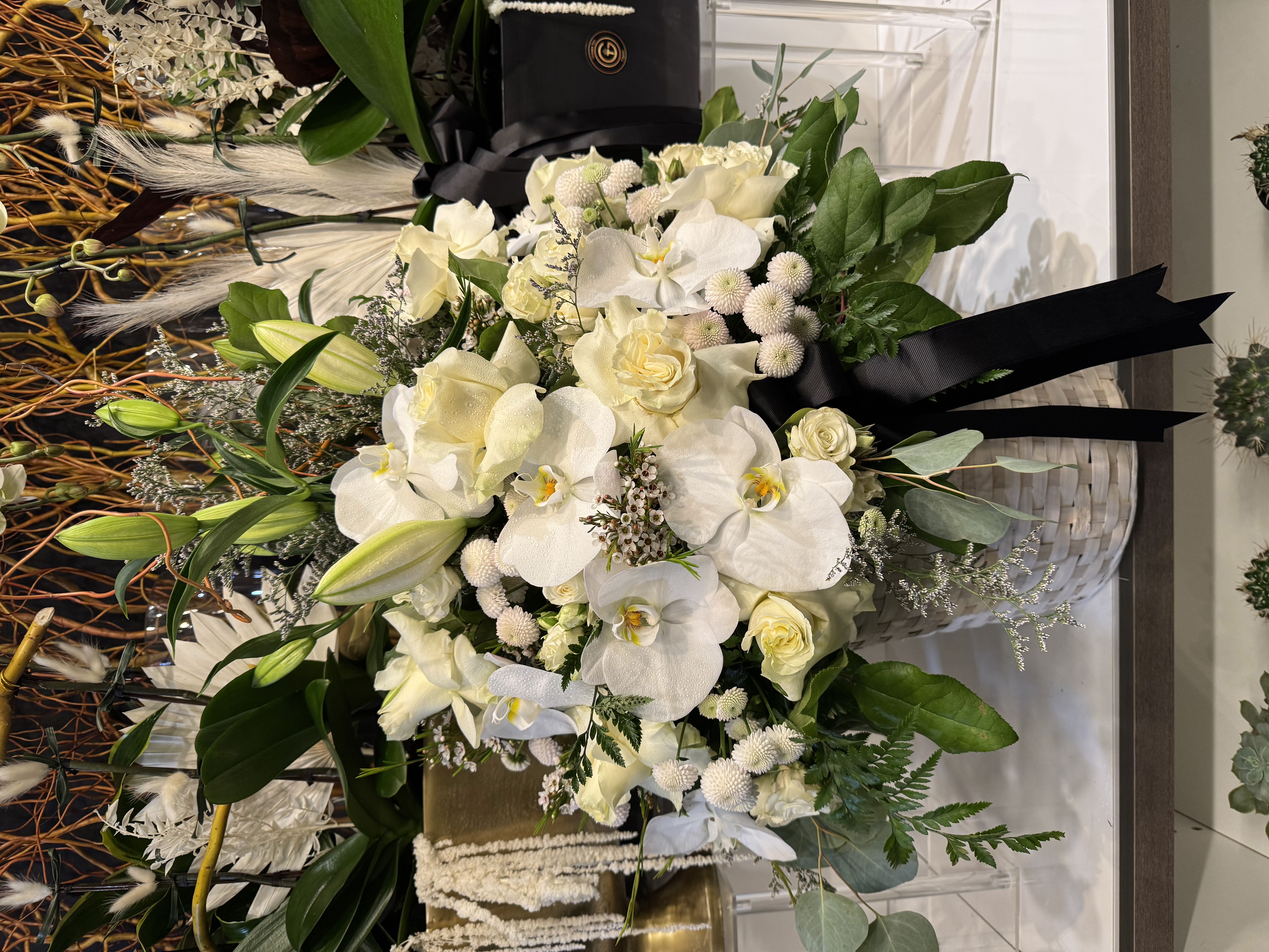 White calla lily and rose floor standing tribute with palm
