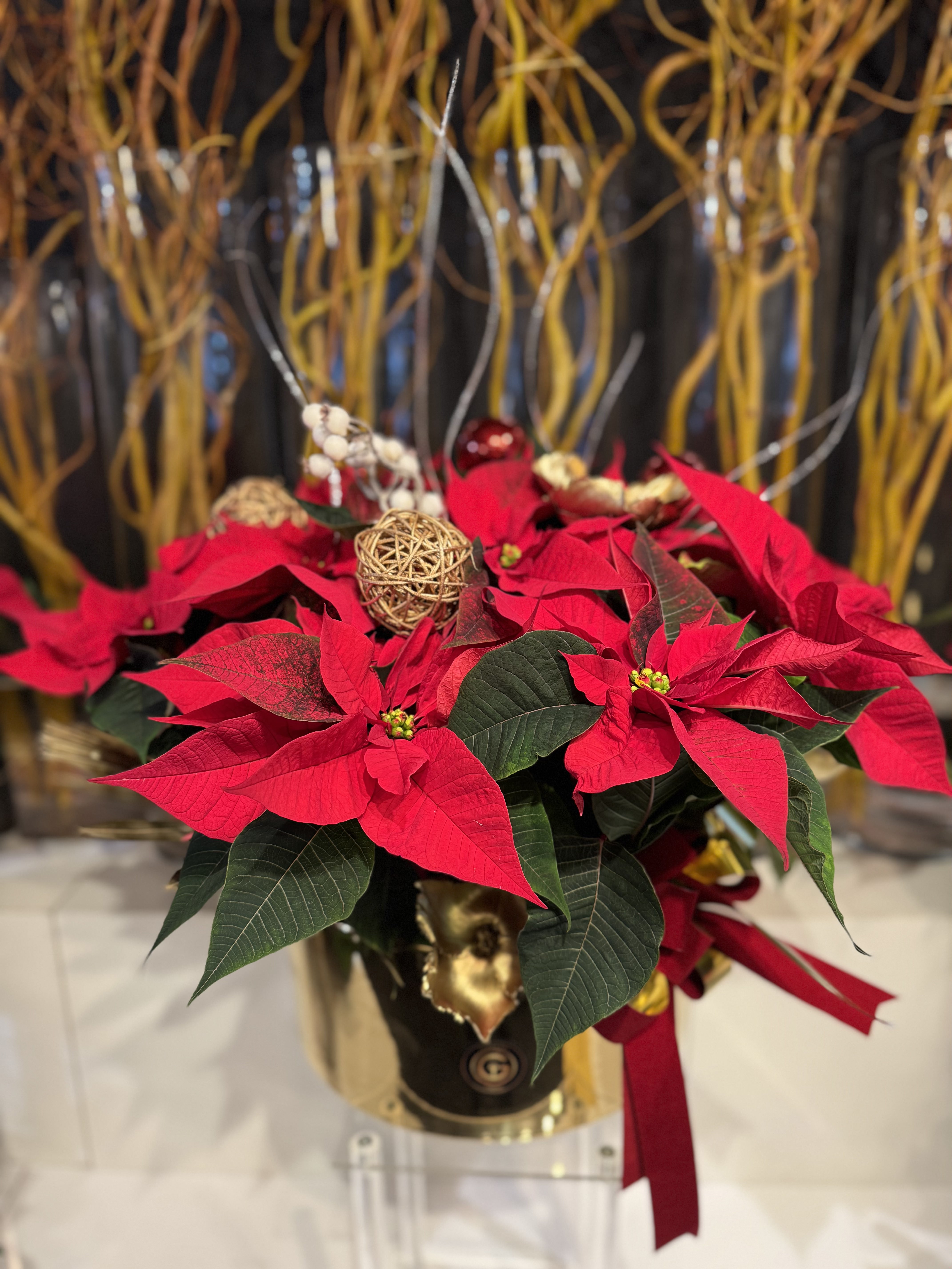 Festive arrangement with rich green garlands and red berries — the essence of Christmas cheer