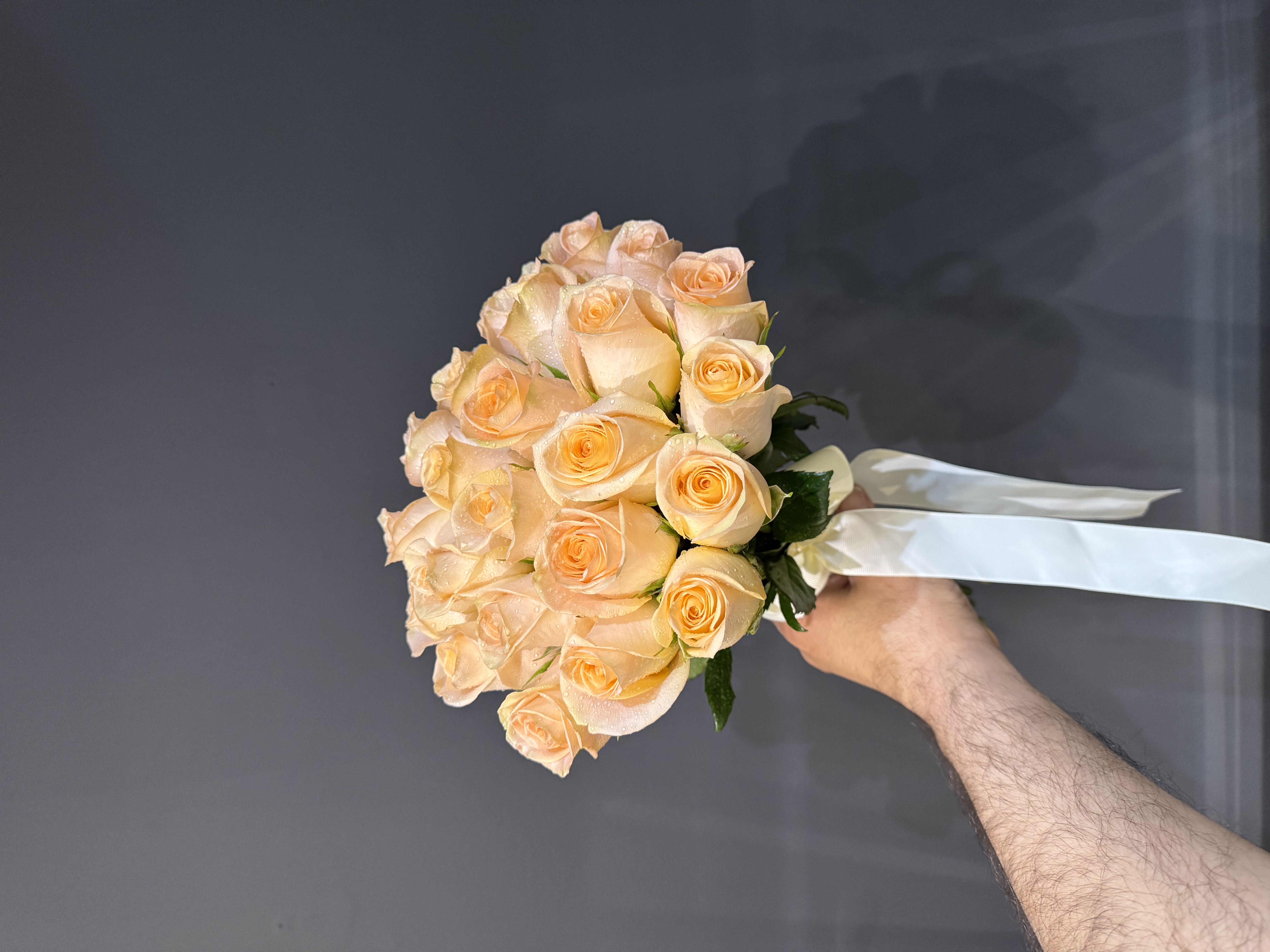 Crystal dew-adorned white peony bouquet with silver eucalyptus and lace wrap