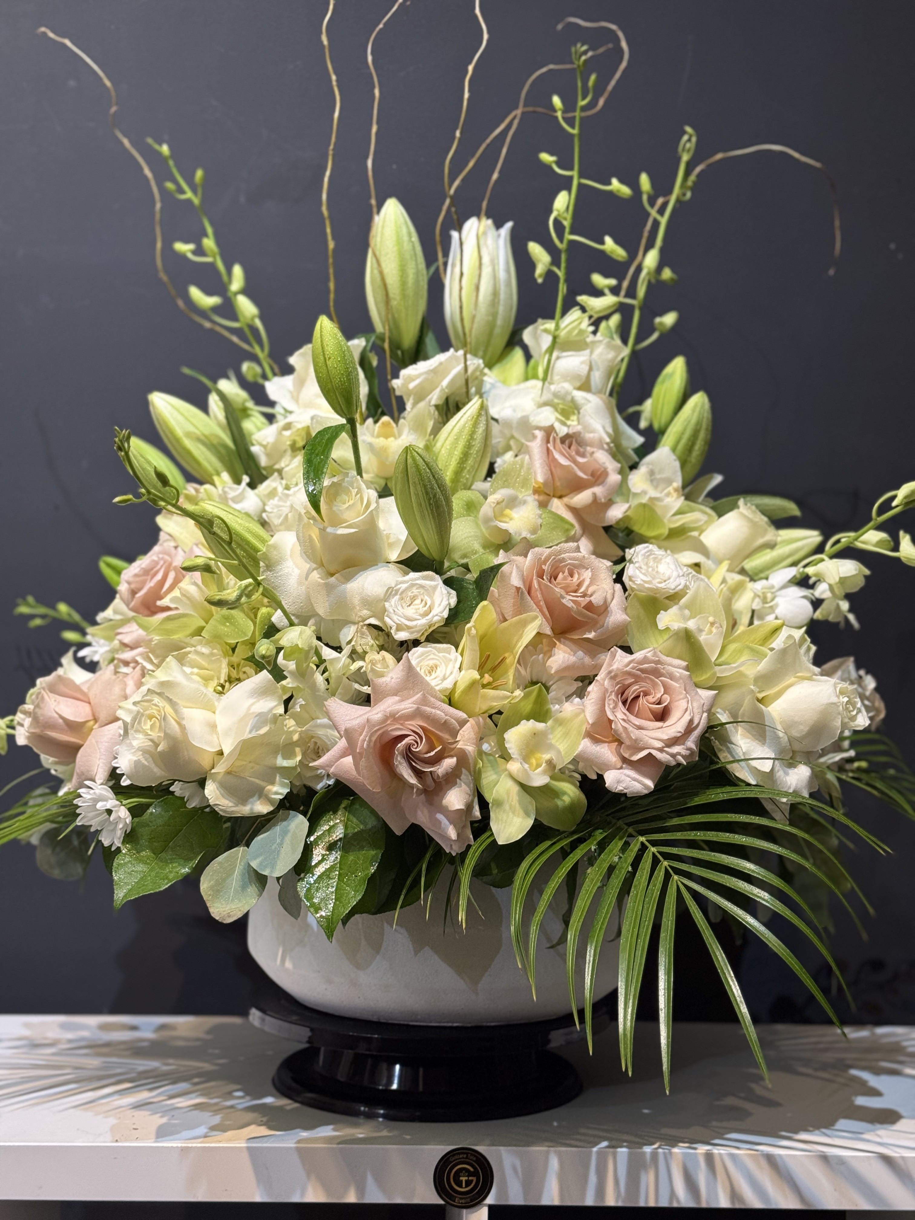 Soft pink peony and hydrangea bridal bouquet with ribbon streamers