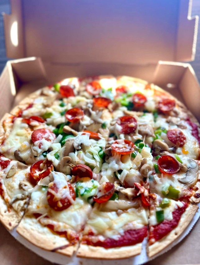 Handcrafted supreme pizza made fresh in the Tipsy Tee Tavern kitchen — loaded toppings, crispy crust, served in Adams, WI