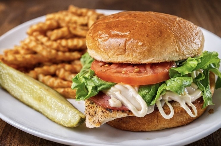 Tipsy Tee Tavern appetizer platter — cheese curds, onion rings, fried green beans and chicken strips served in Adams WI