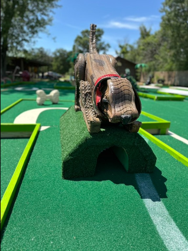 Playing mini golf at Tipsy Tee Tavern Adams WI outdoor course