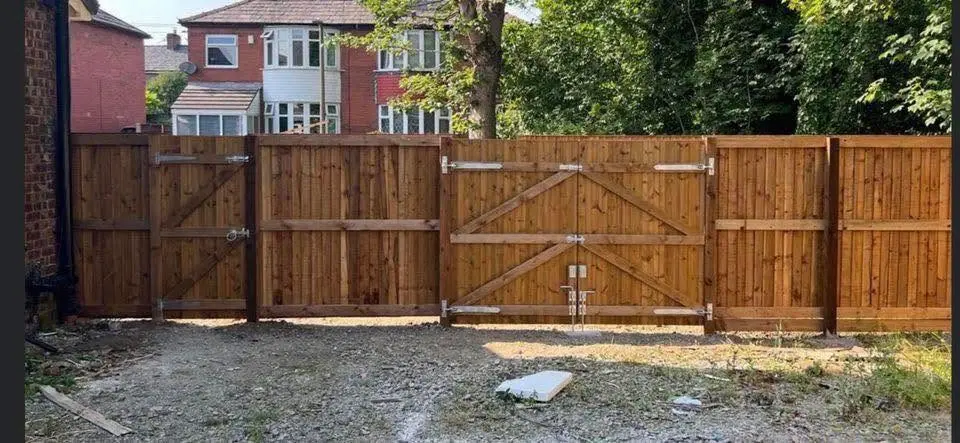 Farnworth Fencing custom wooden fence and double gate installation