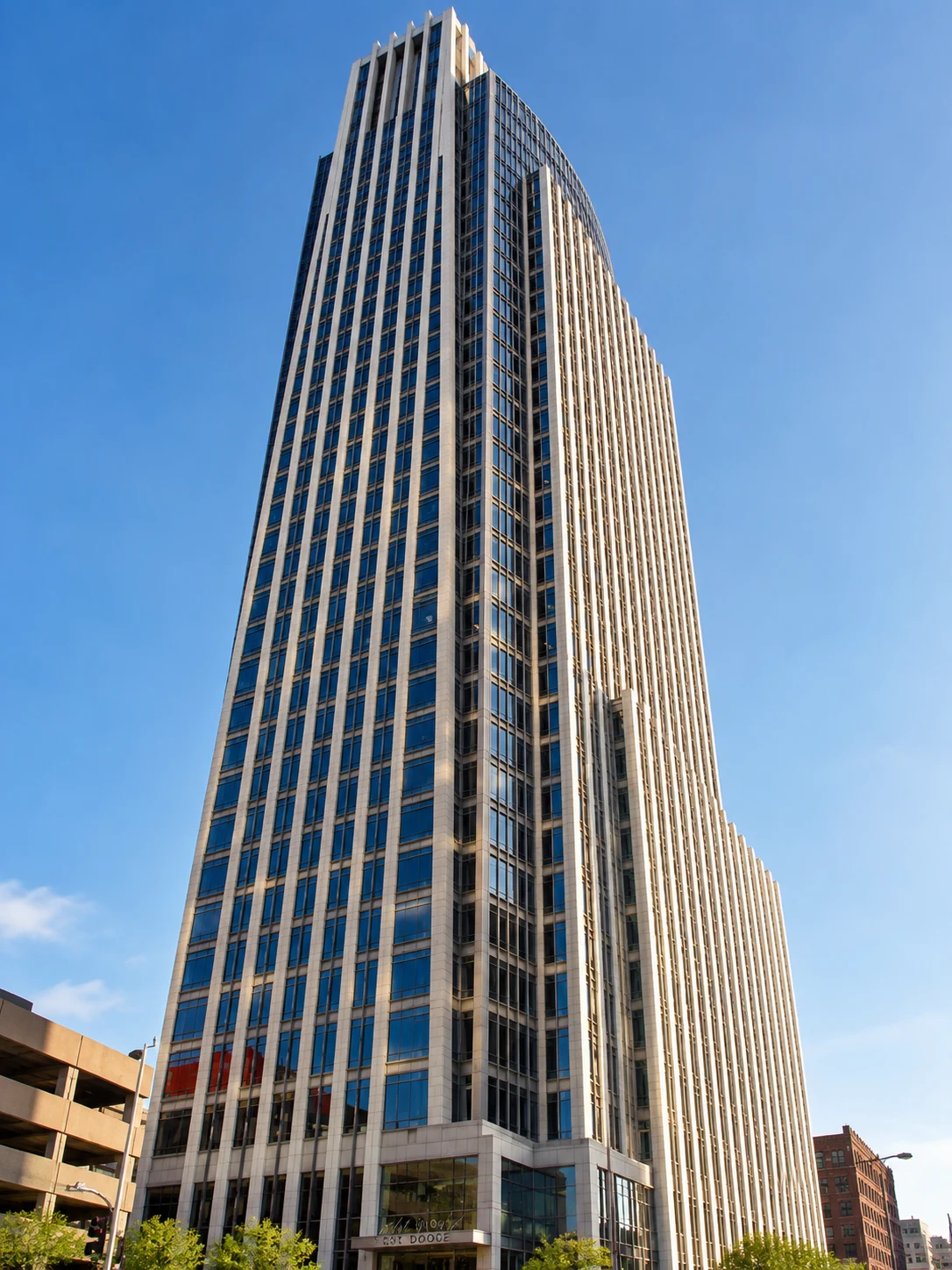 Fast Passport Center office at 1601 Dodge St in downtown Omaha — the iconic First National Bank Tower, a modern glass high-rise in the heart of the Old Market District