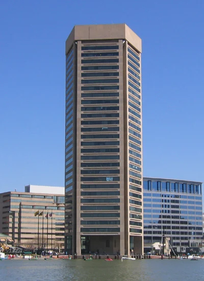 Fast Passport Center office at 401 E Pratt Street, Baltimore — iconic World Trade Center Baltimore tower at the Inner Harbor waterfront
