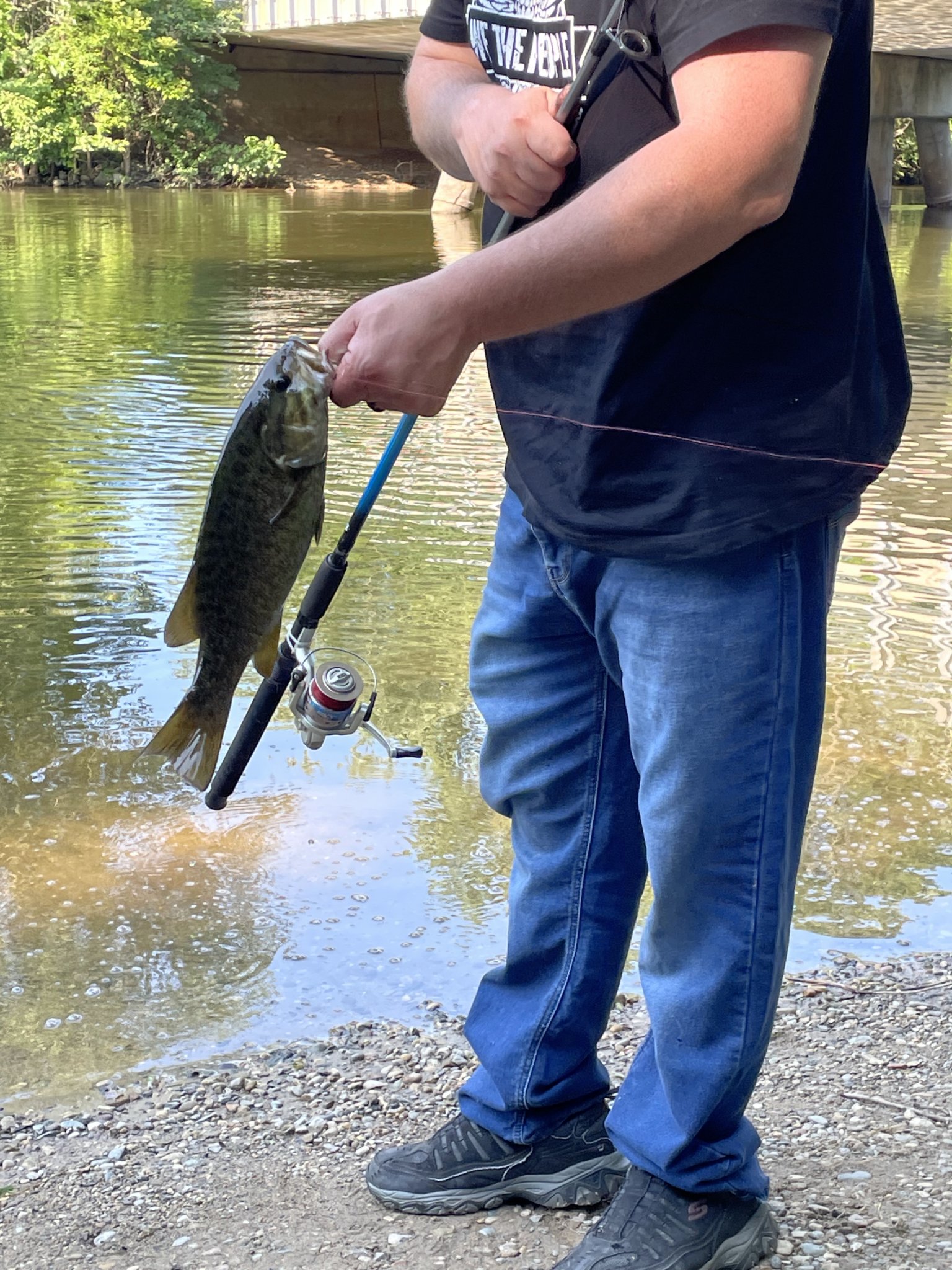 James Sheehy holding a smallmouth bass