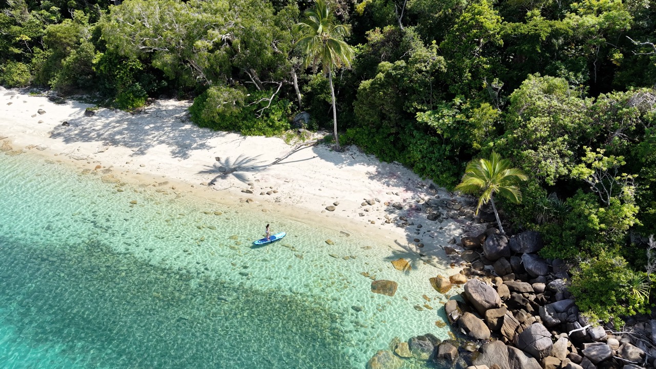 Paddle boarding at Coconut Bay, Dunk Island