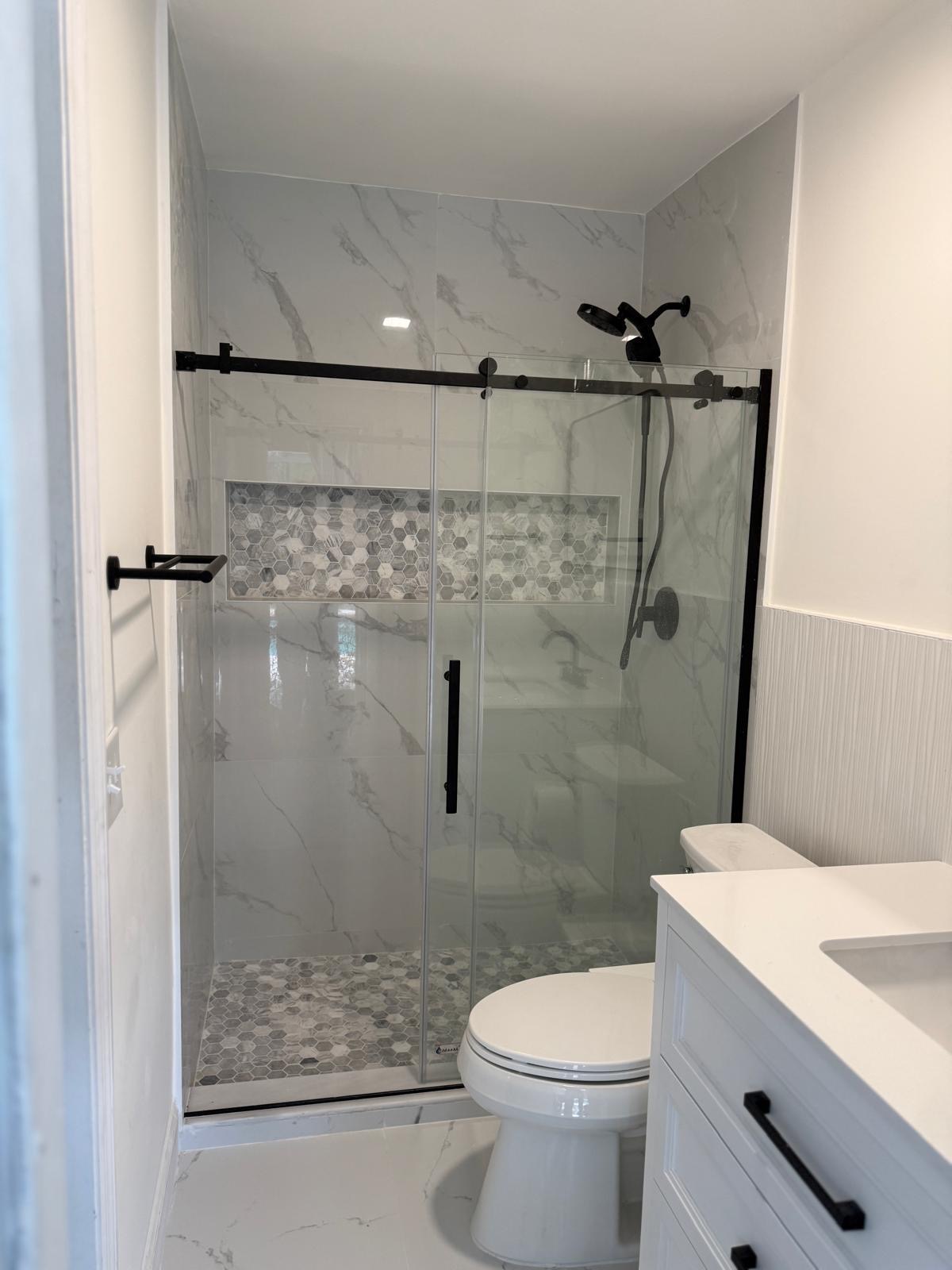 Glass Shower Enclosure with Marble Accent