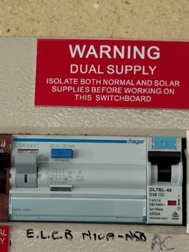 Switchboard with safety warning label