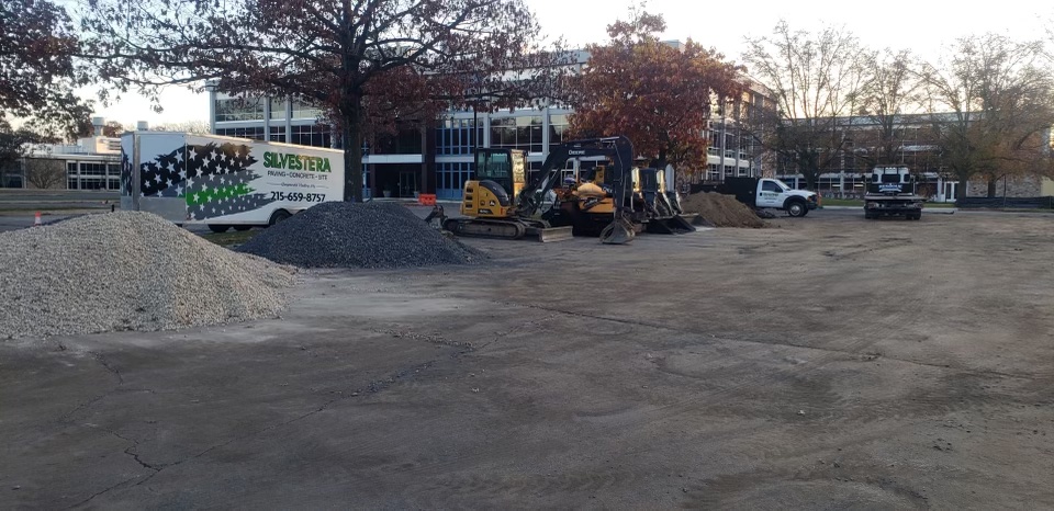 Heavy equipment and crew performing site preparation and grading