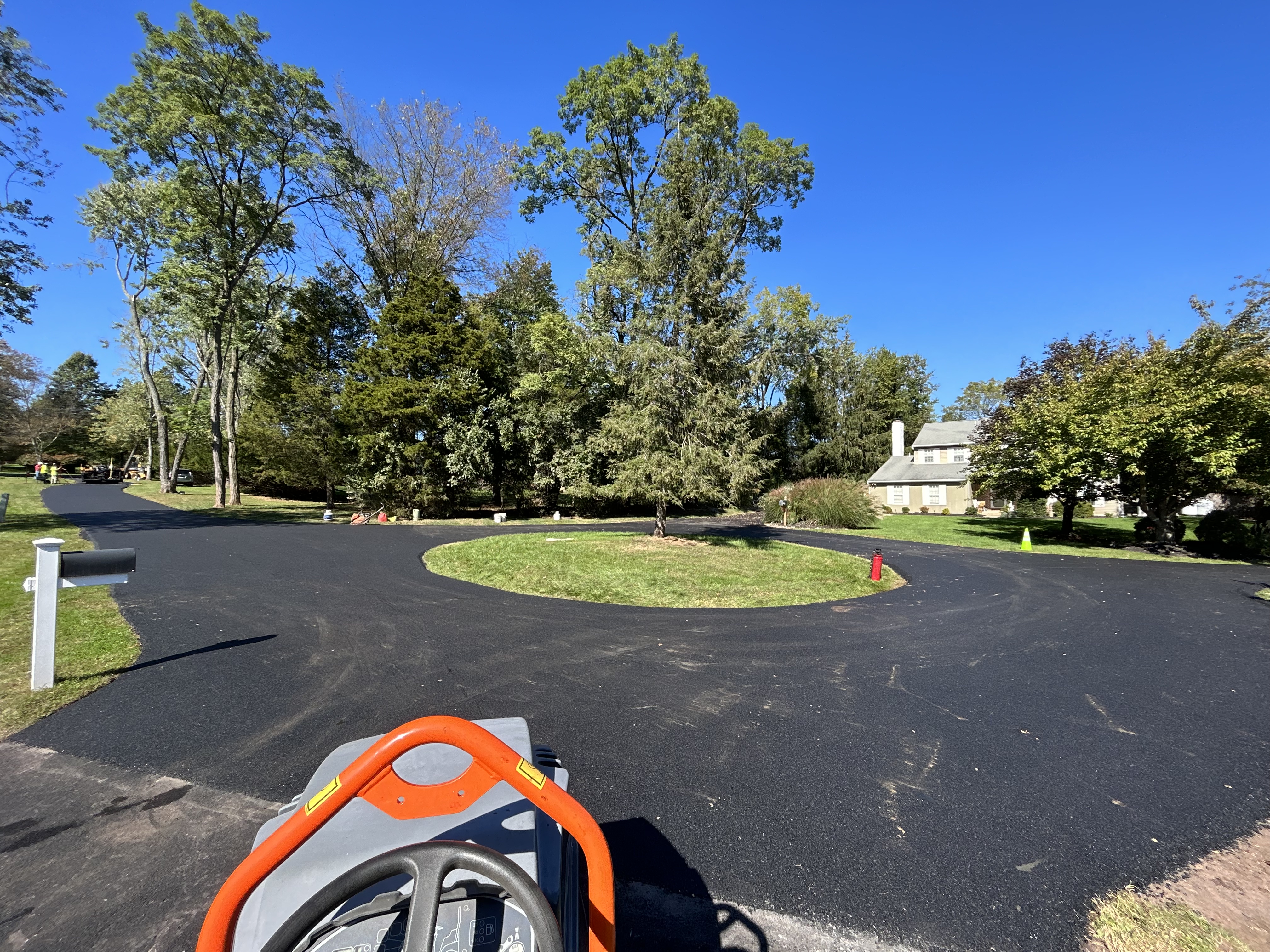 Completed residential driveway paving with clean edges