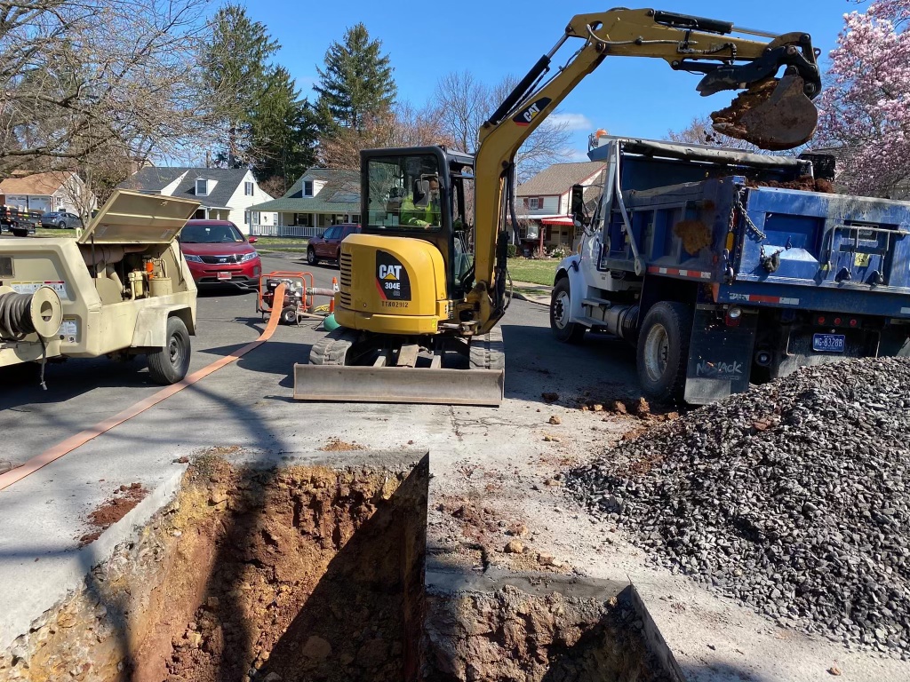 Site work crew finishing grading on commercial property