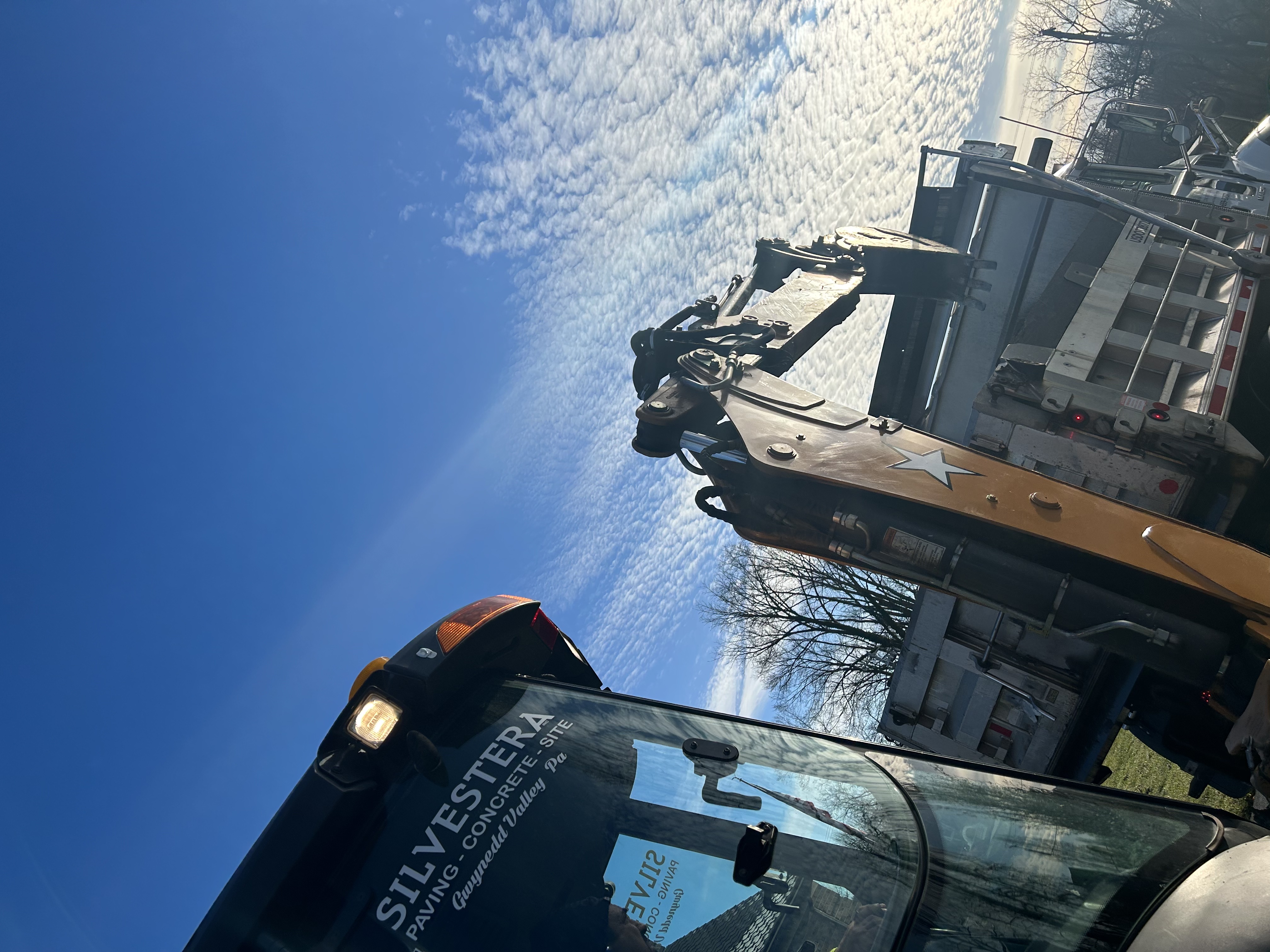 Earthmoving equipment performing cut-and-fill grading operations