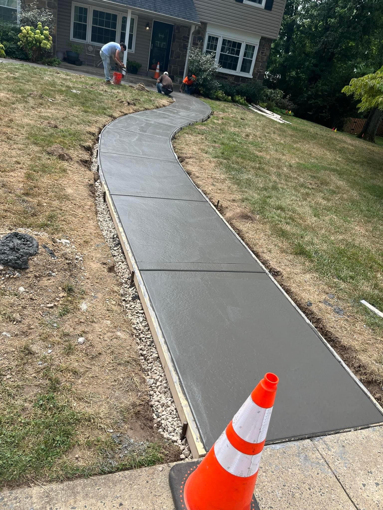 Professional concrete sidewalk with clean edges and proper slope