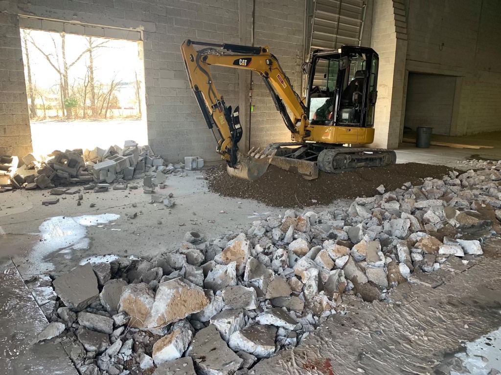 Fresh commercial asphalt being laid on large parking lot