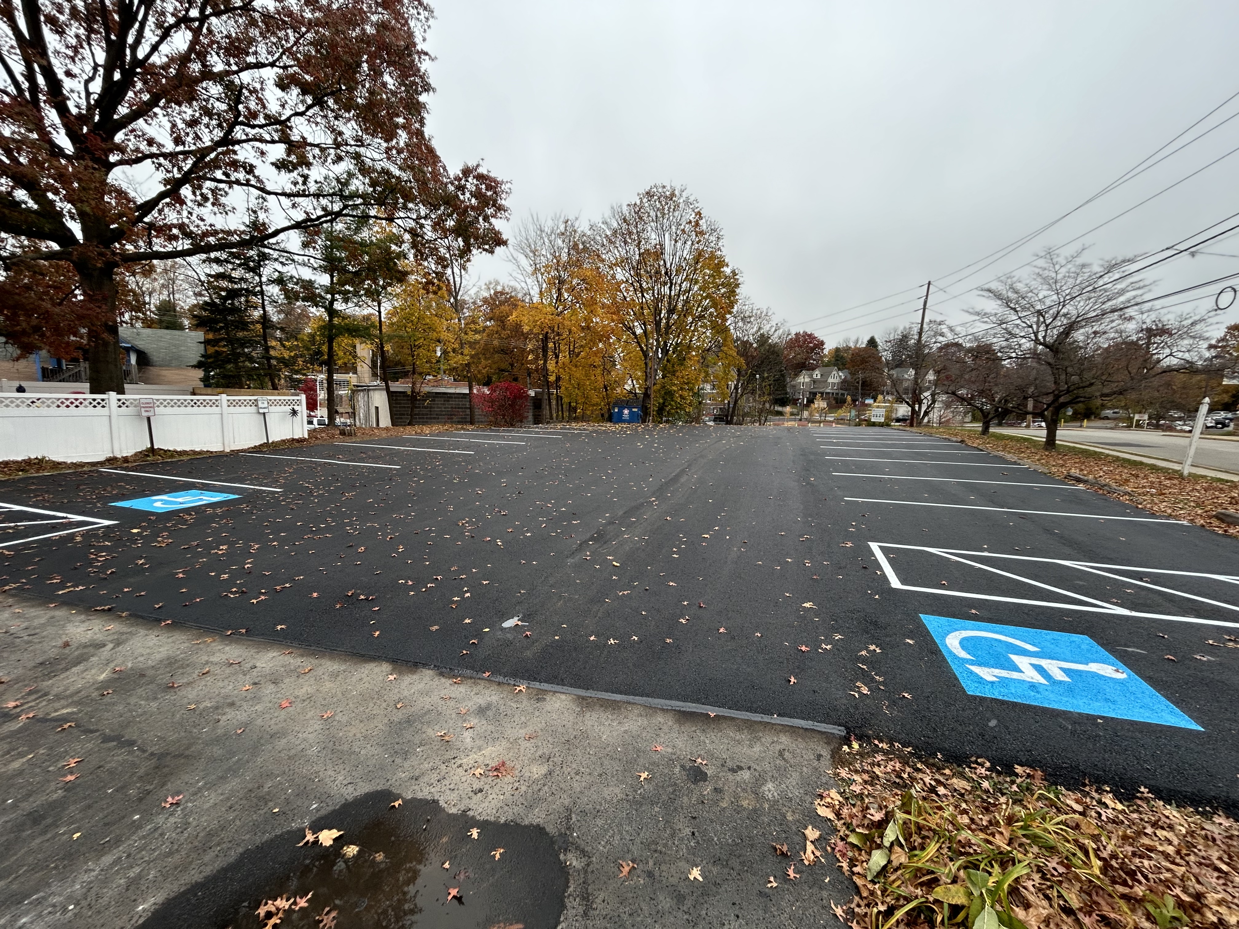 Commercial school campus parking lot with faded markings ready for professional asphalt maintenance and sealcoating service