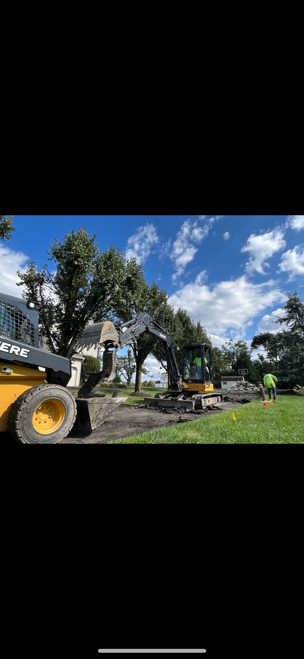 Residential driveway asphalt resurfacing in progress