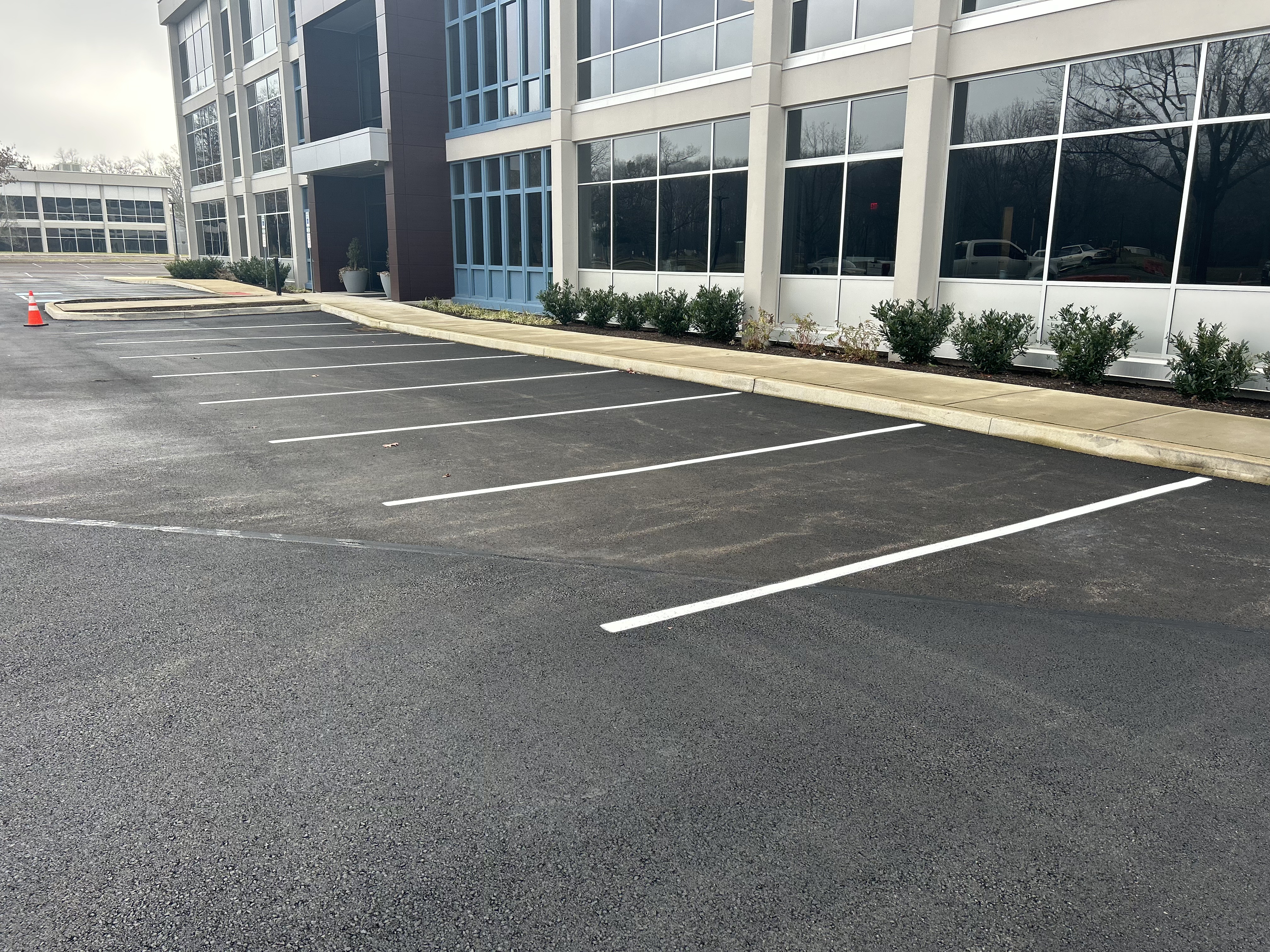 ADA-compliant handicap parking space markings with proper signage and stripe layout