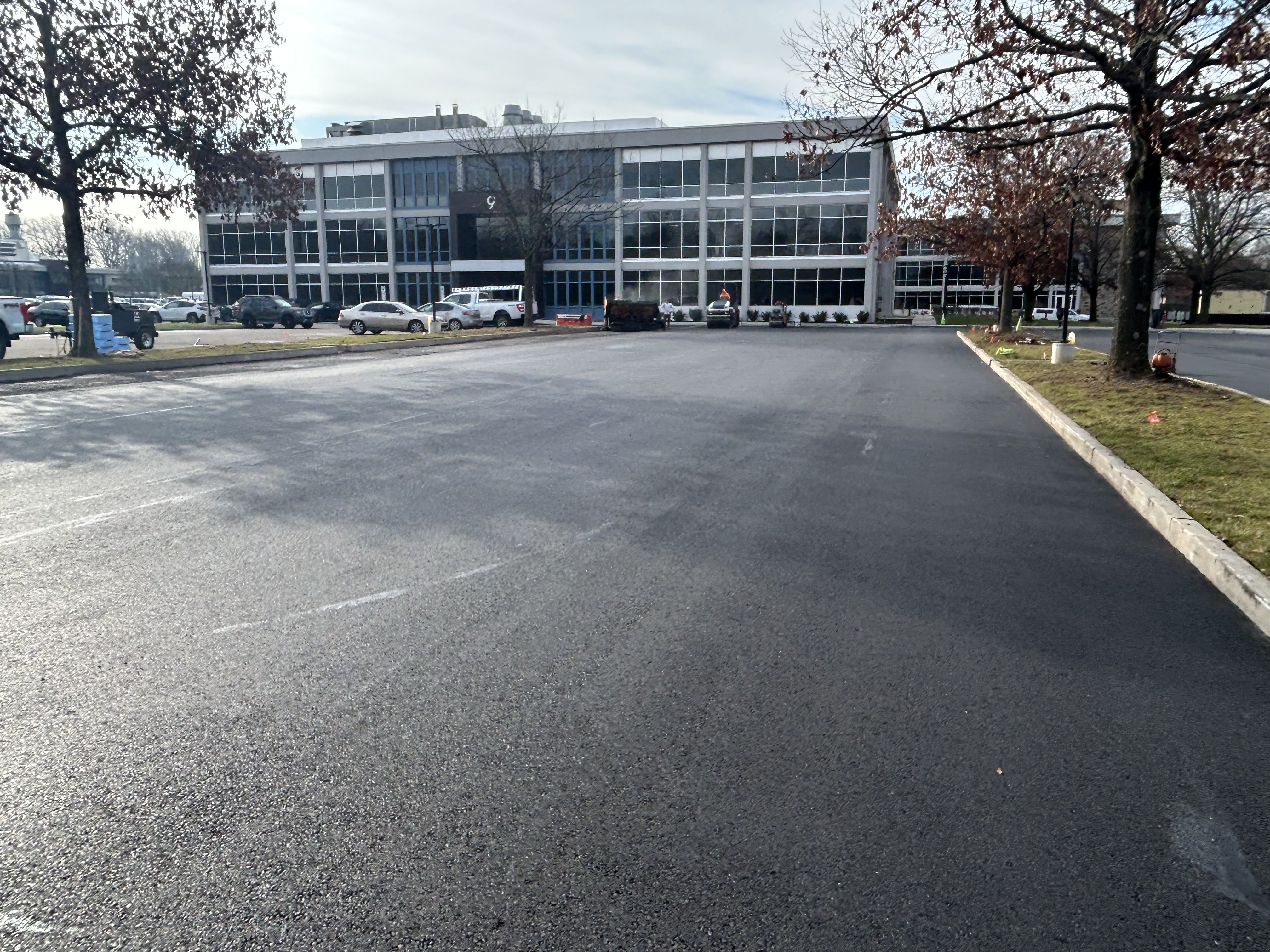 Wide view of commercial paving crew and equipment fleet