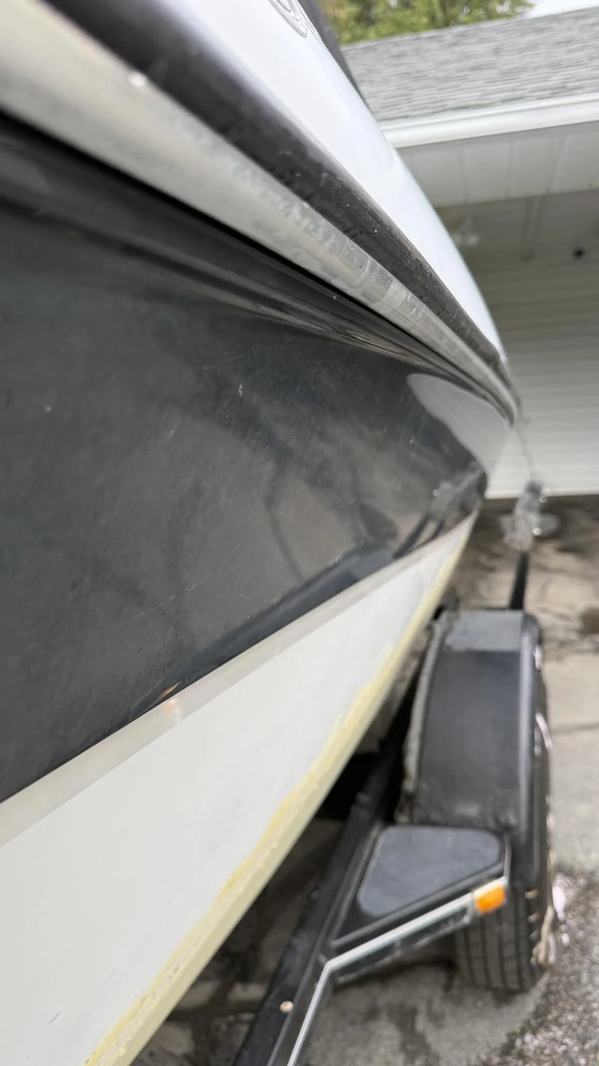 Oxidized boat hull before restoration