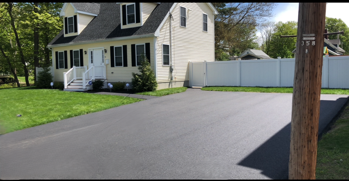 Beautifully paved residential driveway in a Massachusetts neighborhood.