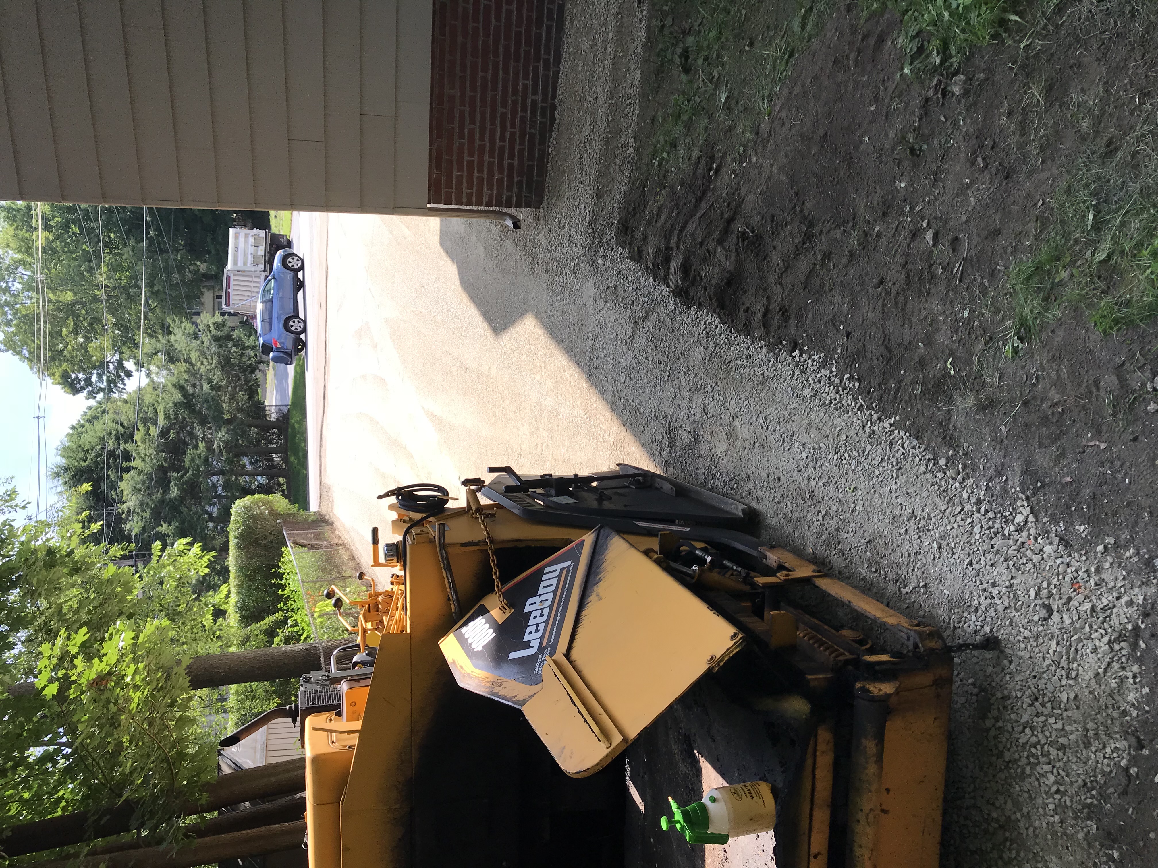 Before: Old deteriorated driveway surface in North Andover, MA — full driveway replacement