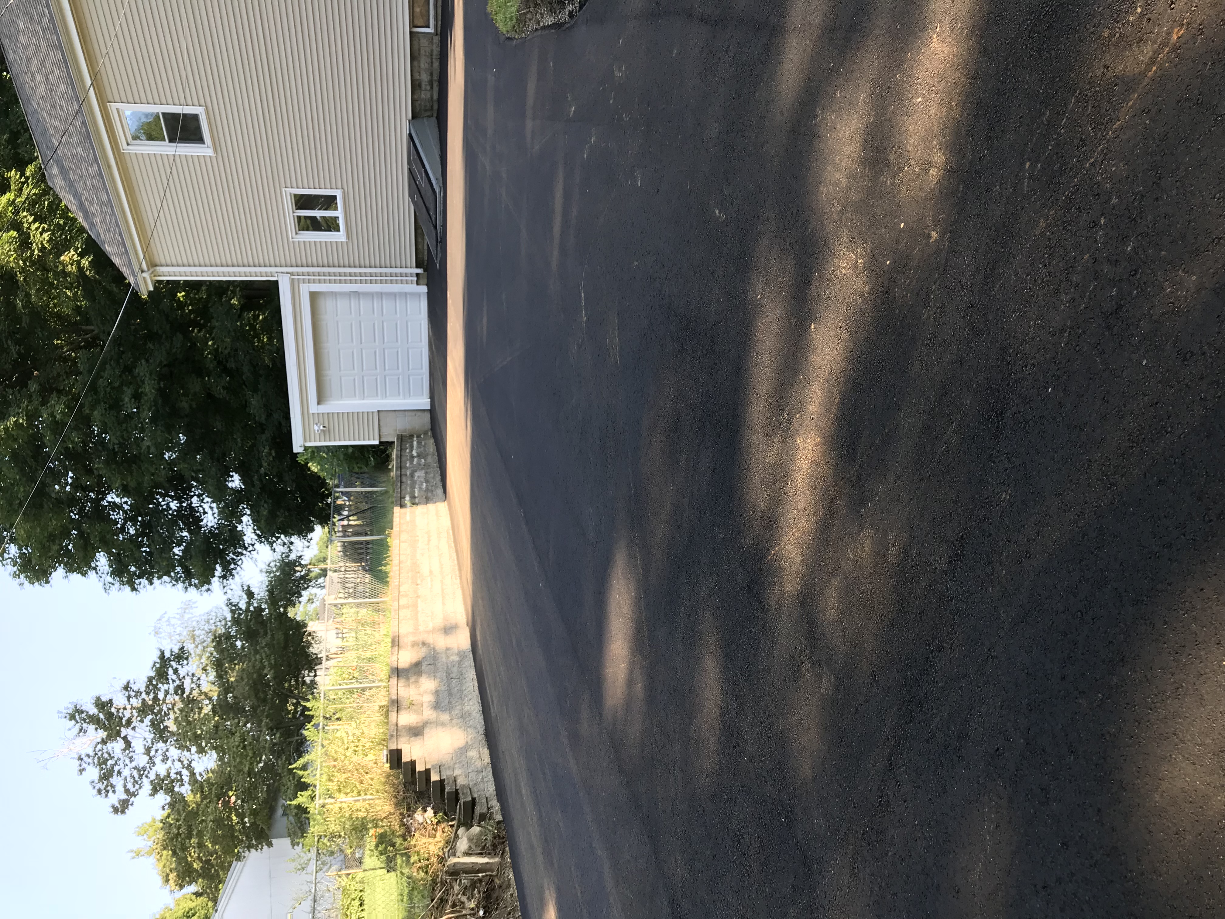 Completed asphalt paving project by Unique Asphalt Paving