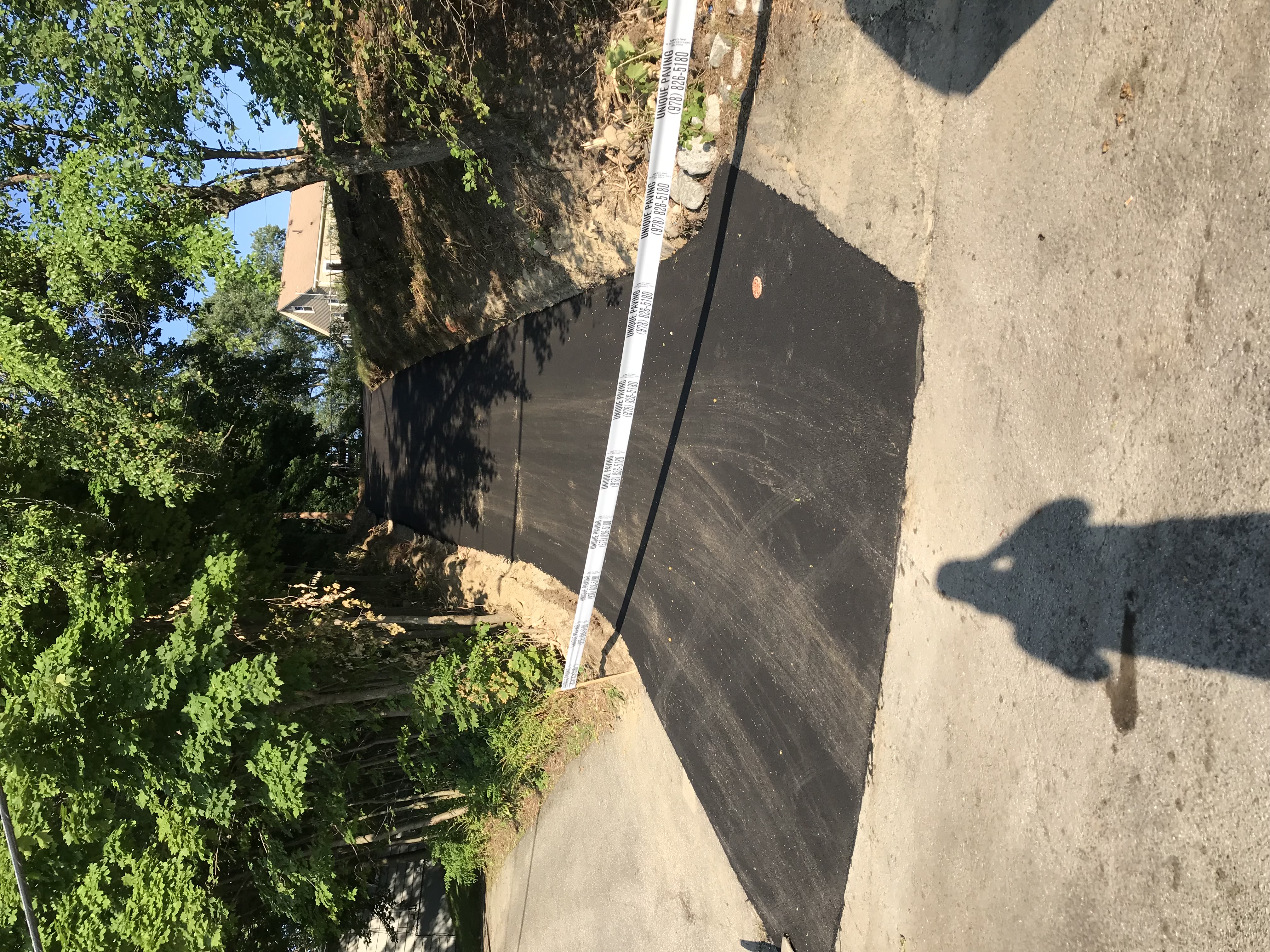 After: Clean smooth asphalt driveway — residential paving in Georgetown, MA