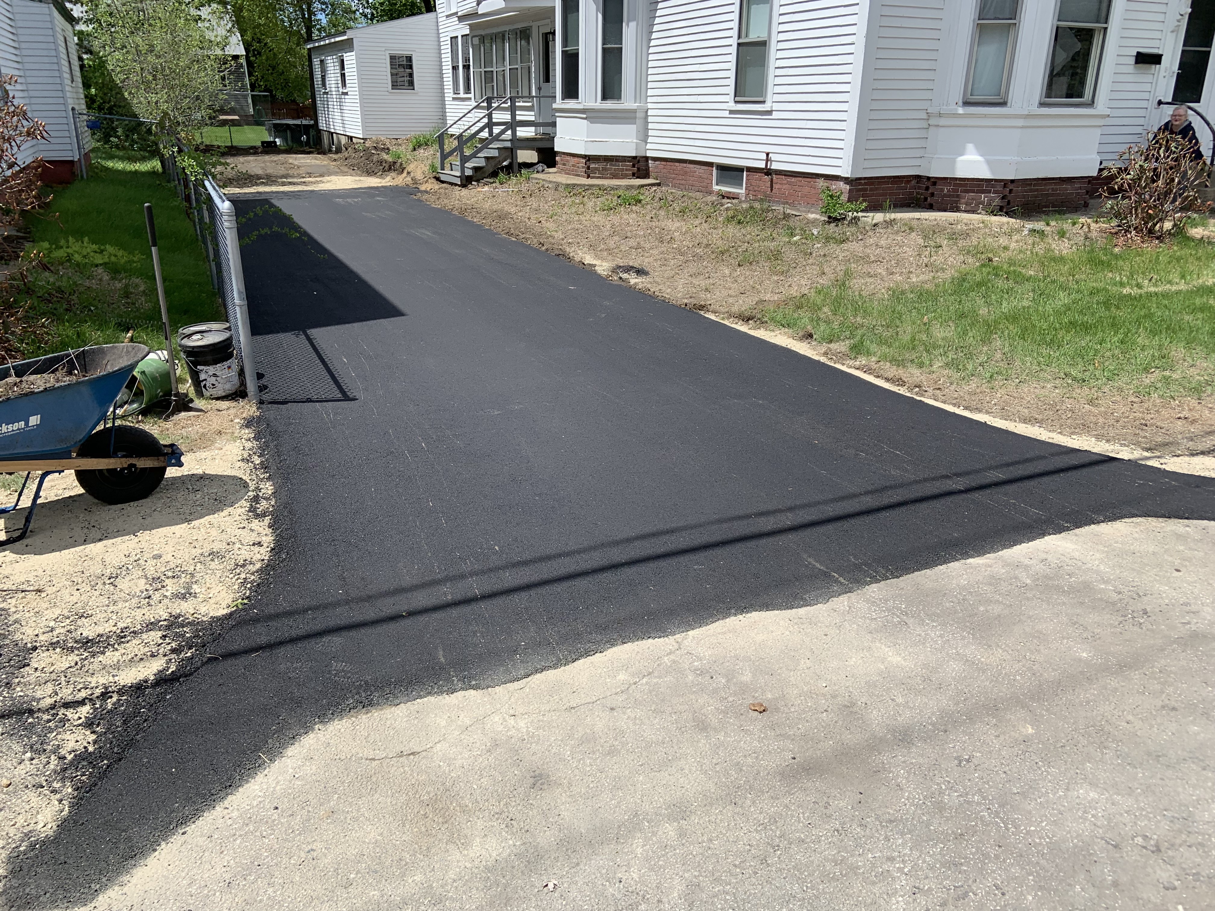 Driveway paving project with clean black asphalt finish in Boxford, MA
