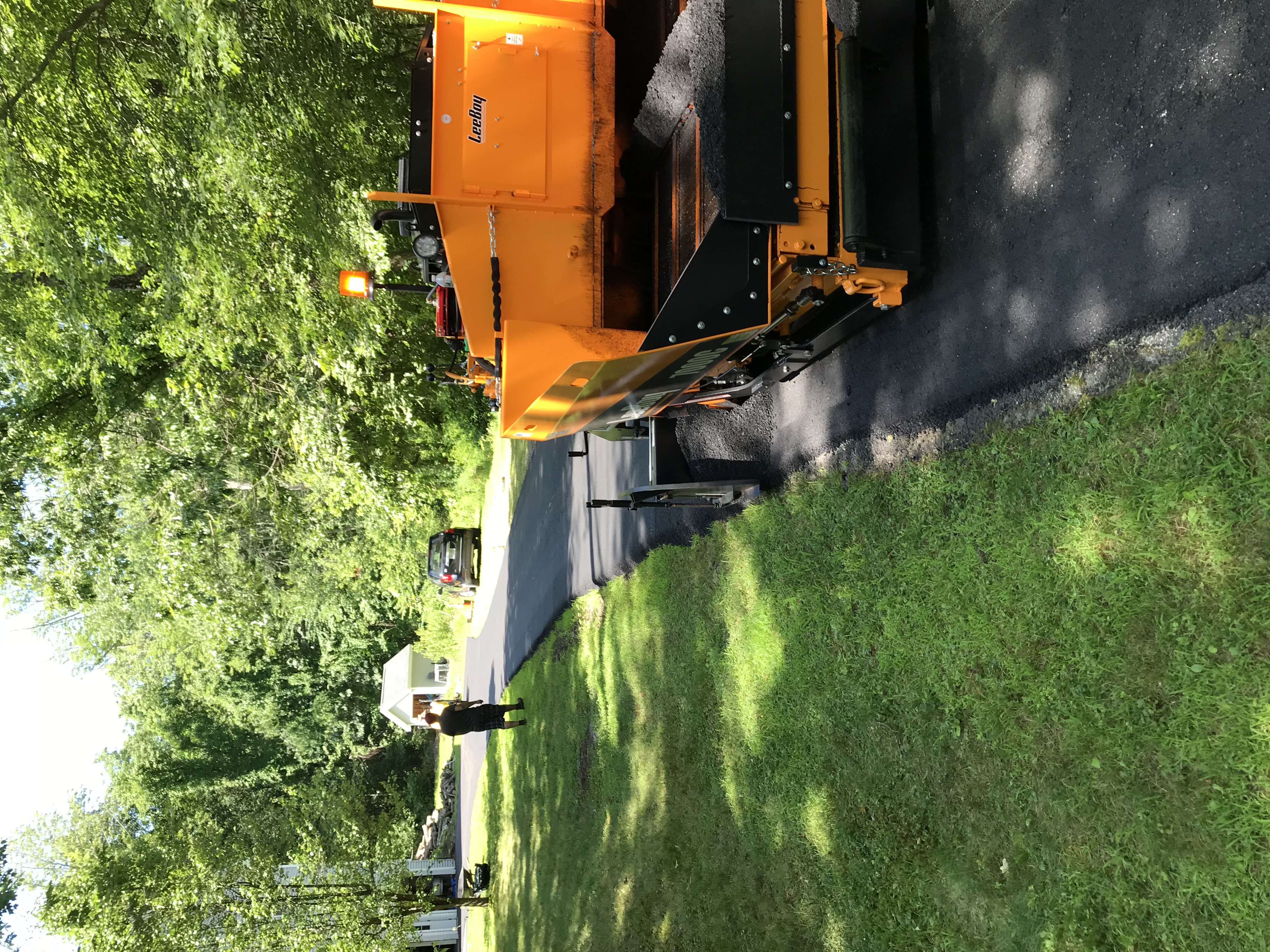 Professional asphalt paving crew at work in Massachusetts