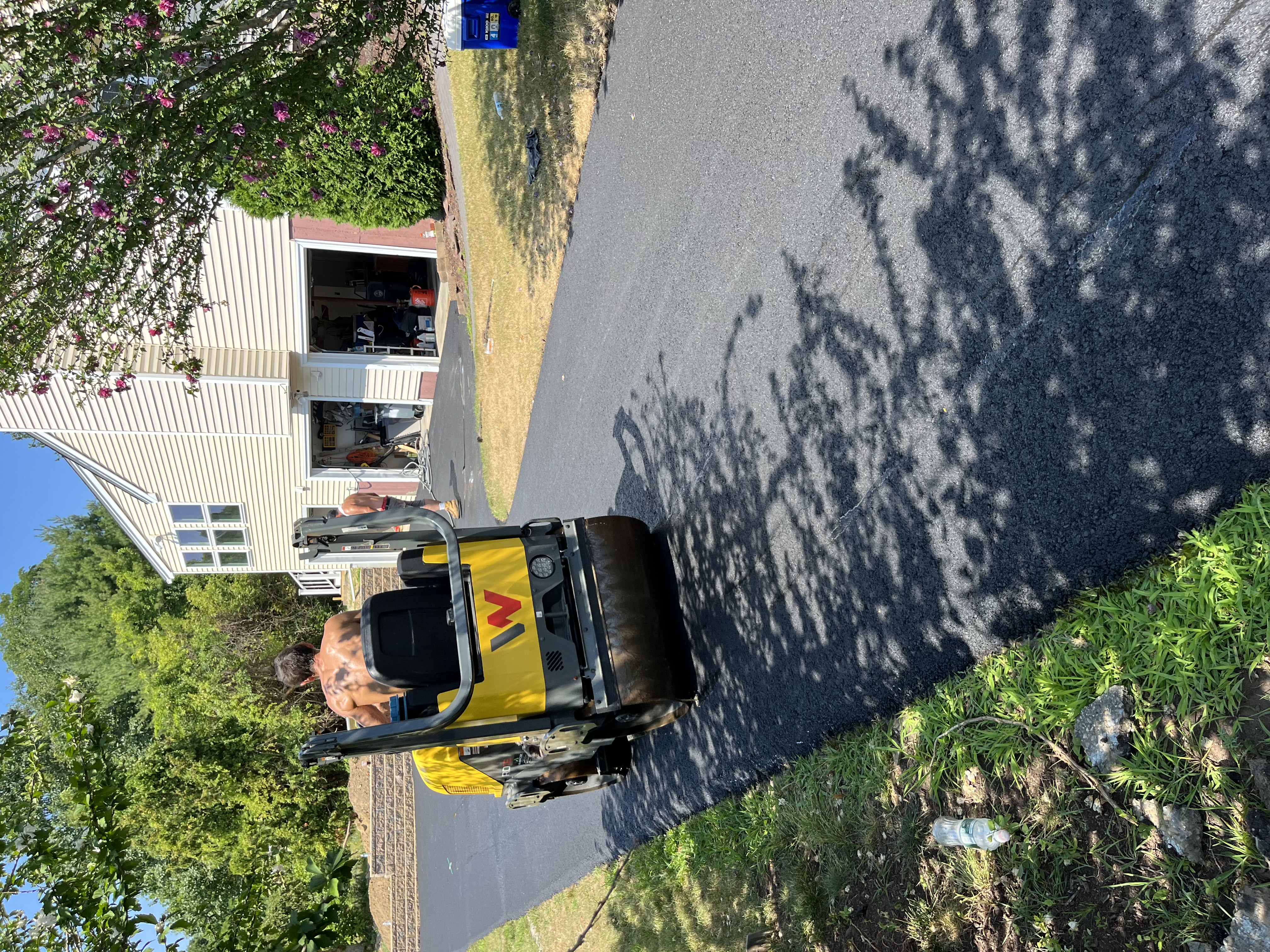Smooth freshly paved asphalt surface for new construction driveway in West Newbury, MA