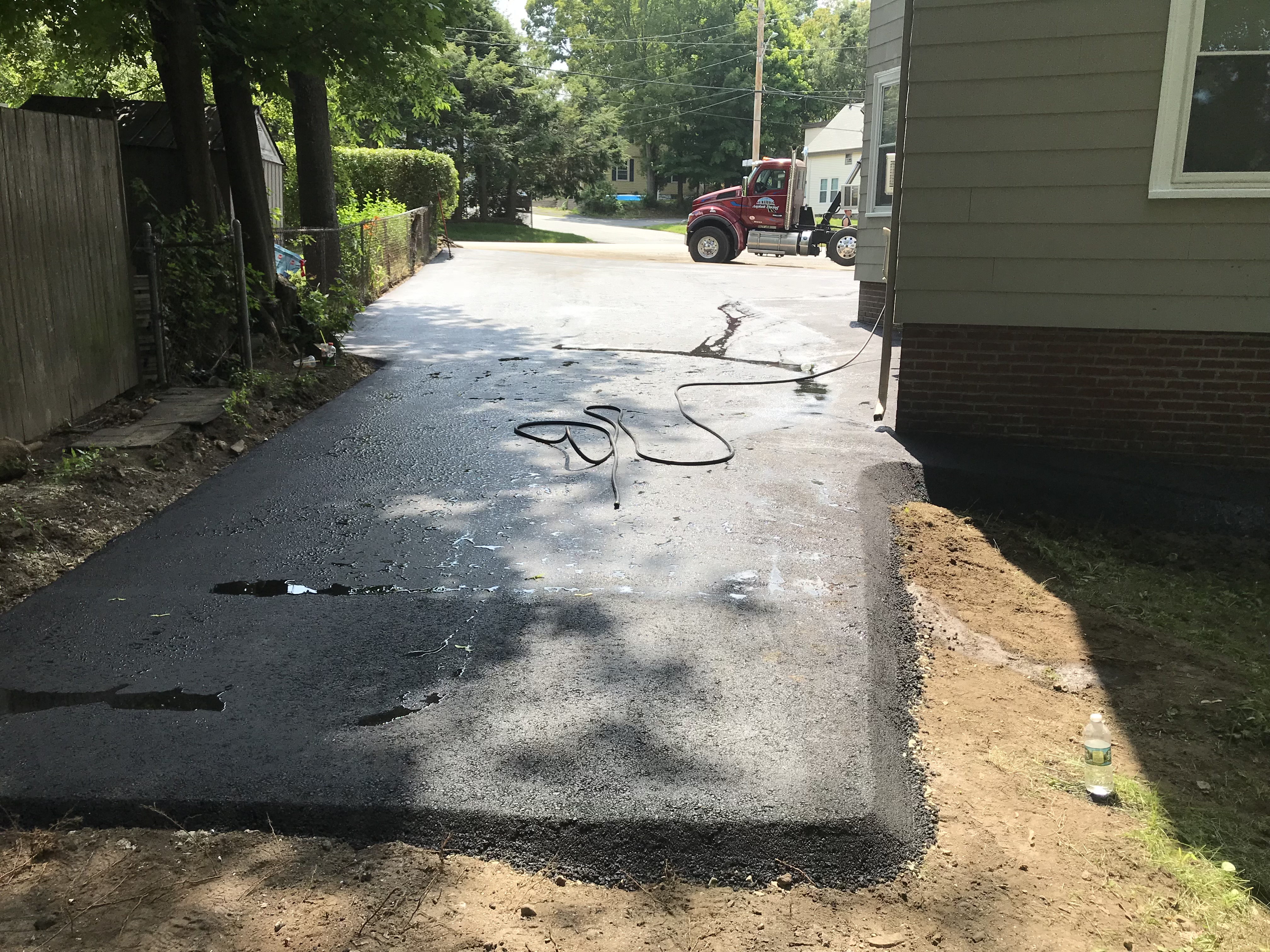 After: Brand new complete driveway replacement in North Andover, MA by Unique Asphalt Paving