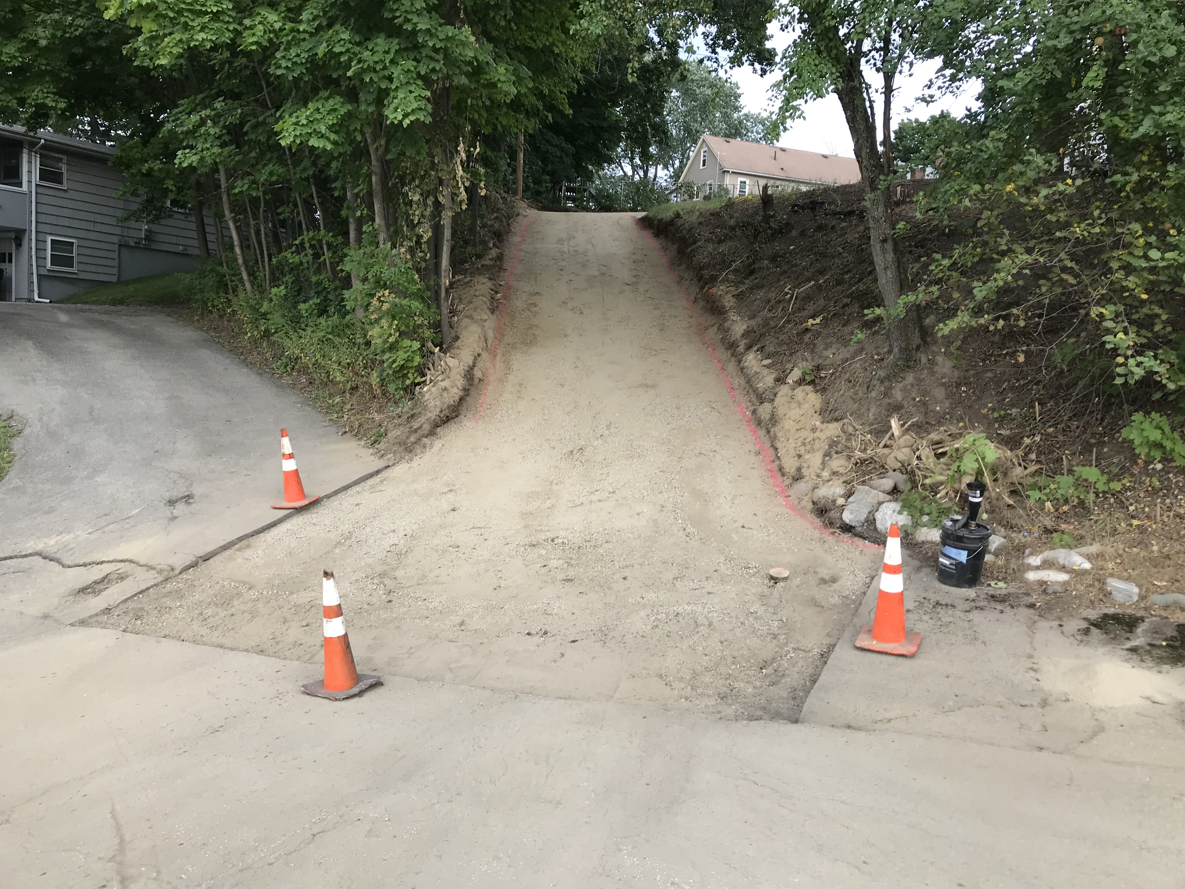 Before: Gravel and deteriorated driveway surface in Georgetown, MA — residential paving
