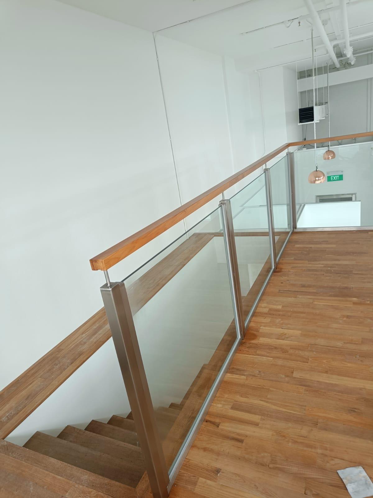 Glass Railing with Round Wooden Handrails glass installation project in Singapore