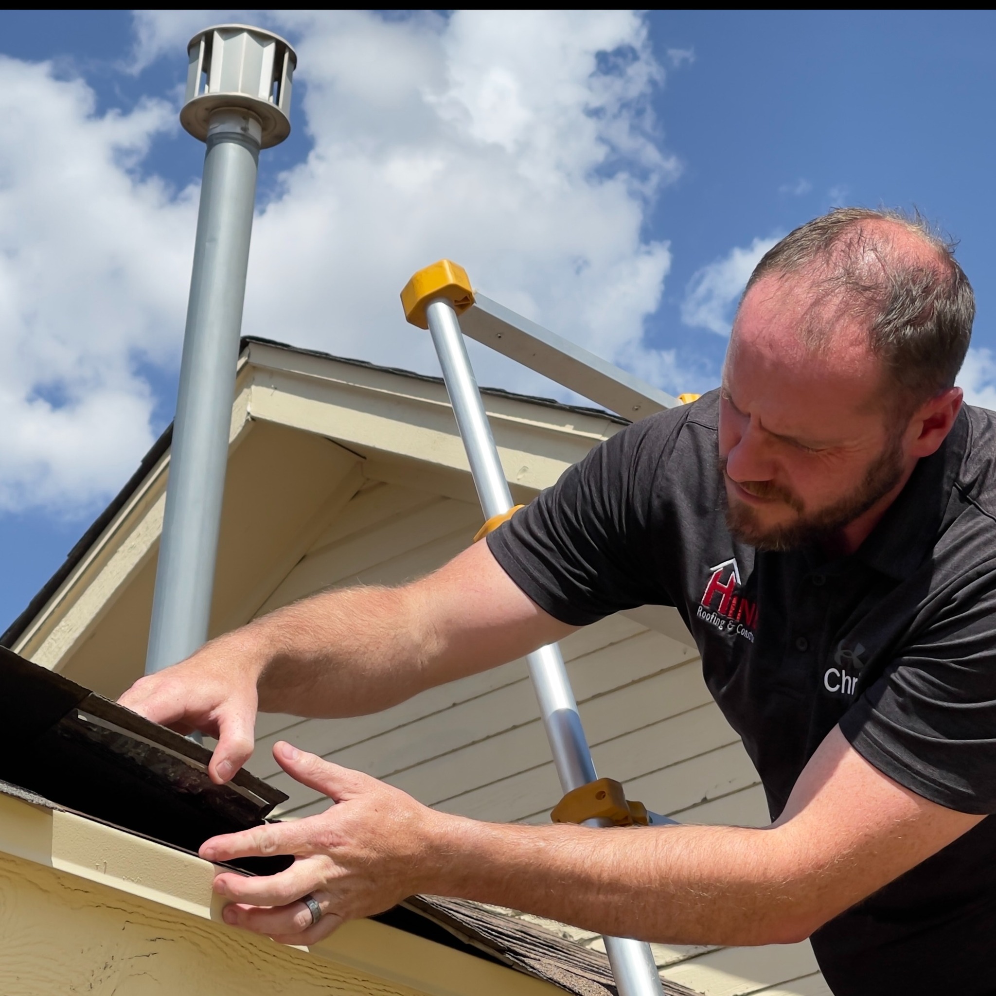 Homeowners reviewing their documented roof inspection