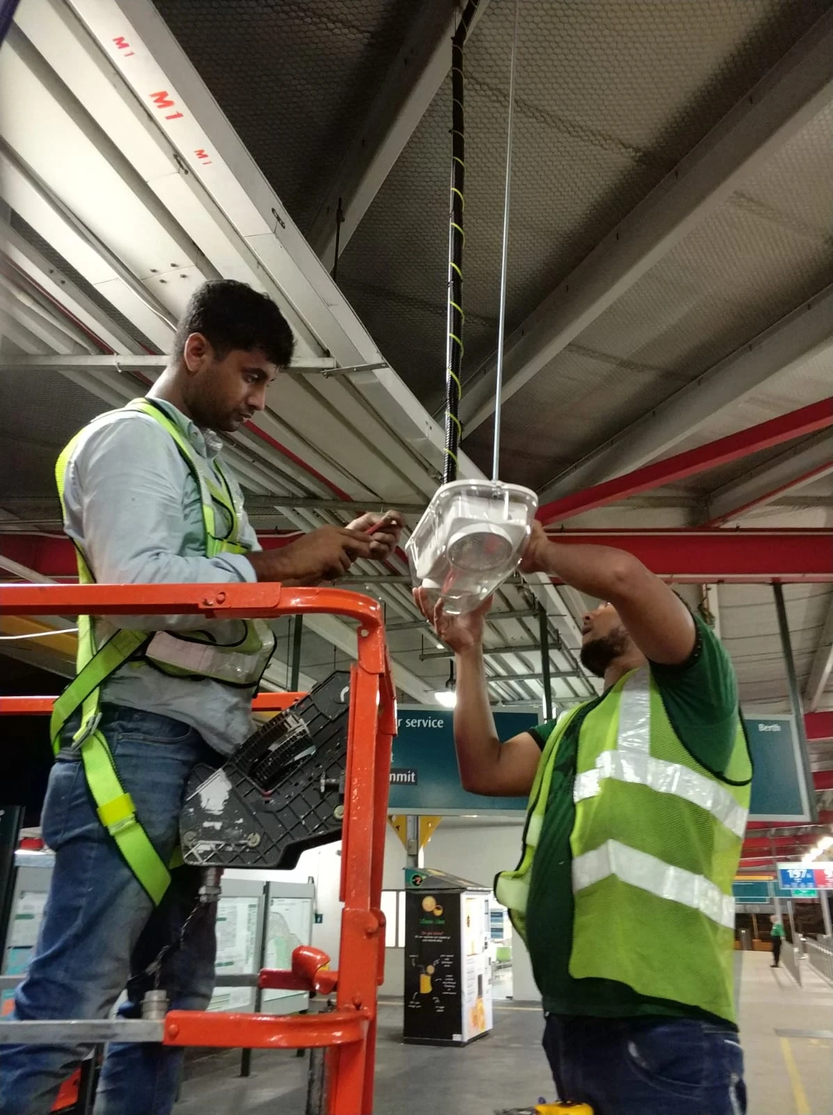 Ezzogenics workers installing emergency lighting on site