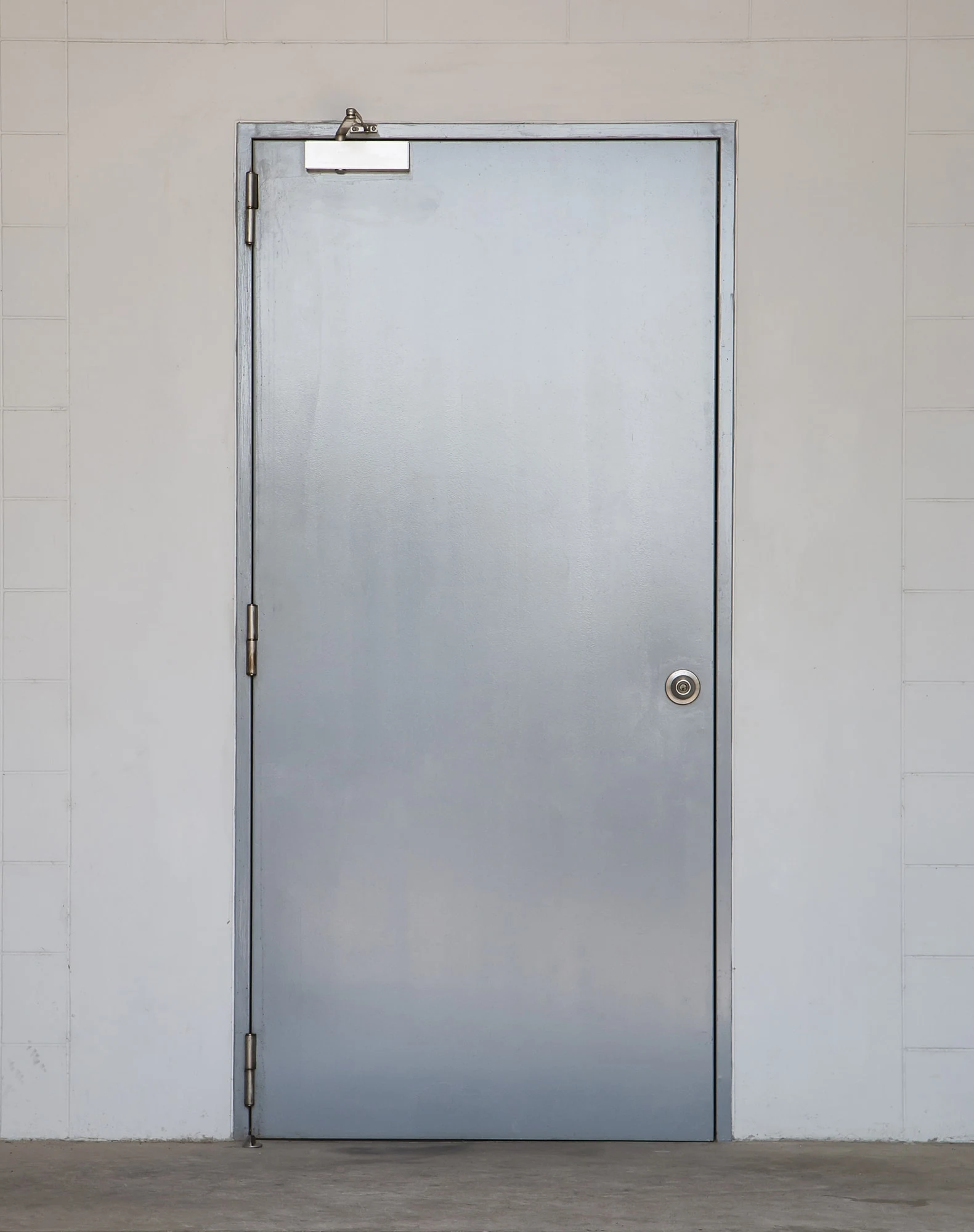 Industrial fire-rated steel door with automatic closer mechanism